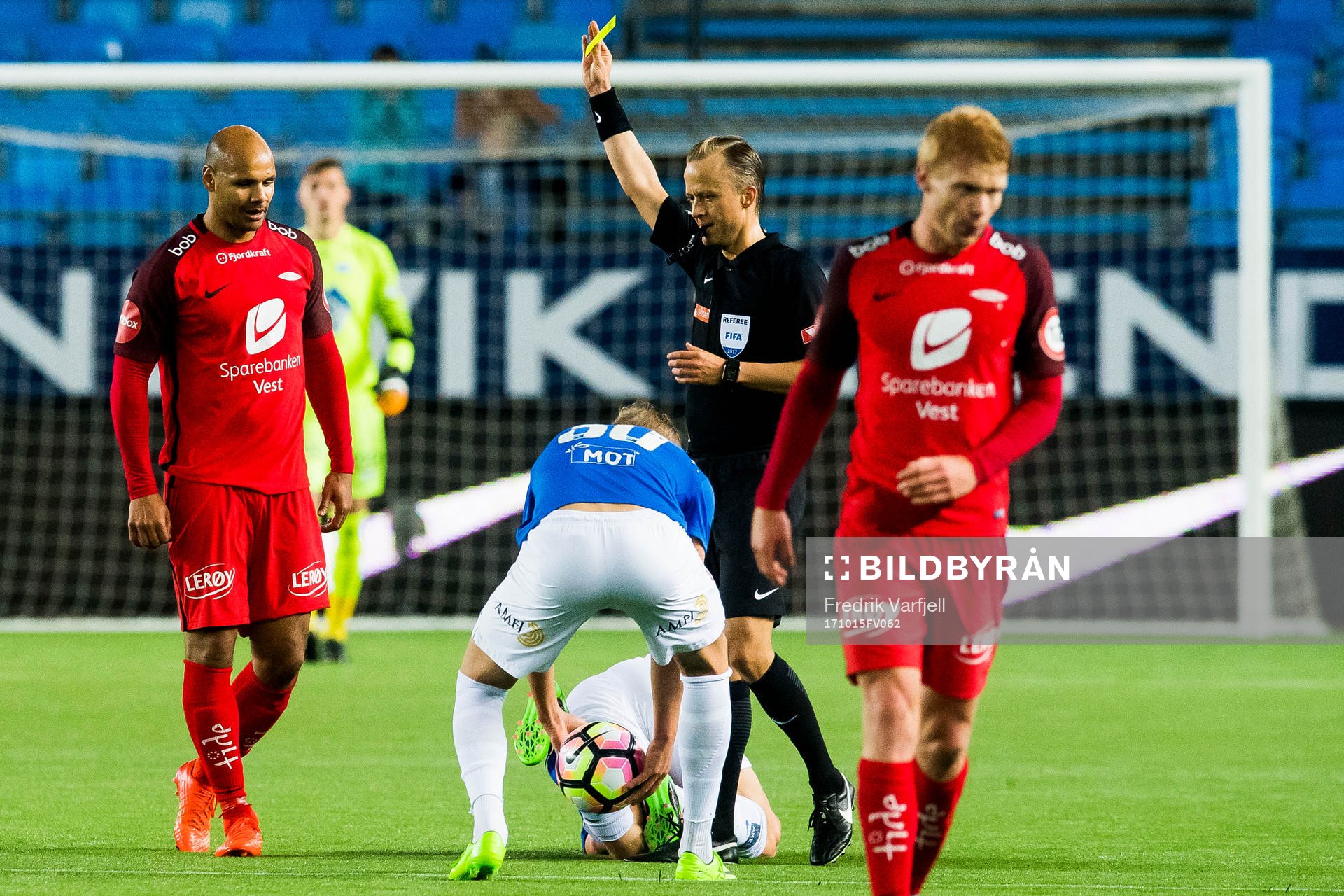 Daniel Braaten of Brann is shown the yellow card by Ola