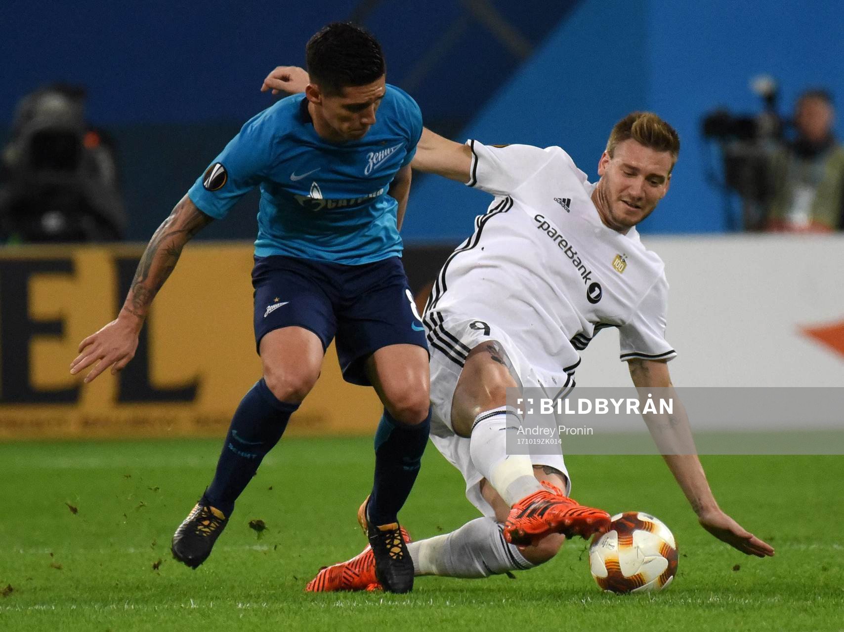 Russia. St. Petersburg. October 19, 2017. Zenit s Mathias Kranevitter and Rosenborg player Niklas Bendtner (left to right) during the UEFA Europa League group stage match between Zenit (Russia, St. Petersburg) and Rosenborg (Norway, Trondheim).