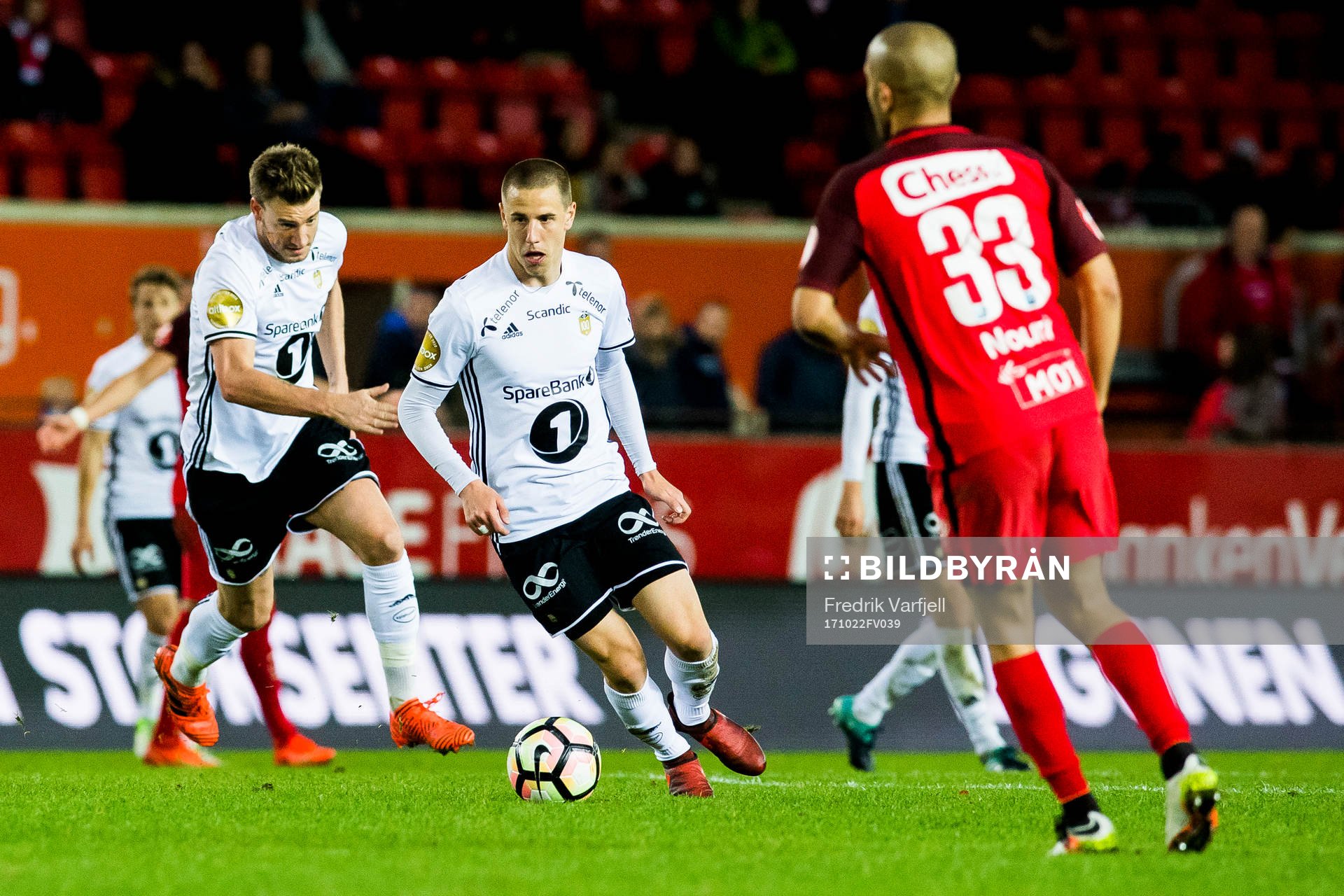 Nicklas Bendtner and Milan Jevtovic of Rosenborg and Amin