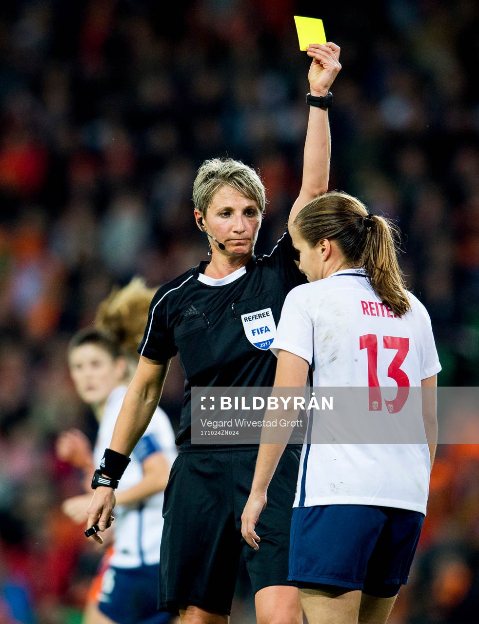 Referee Jana Adamkova of the Czech Republic hands out a