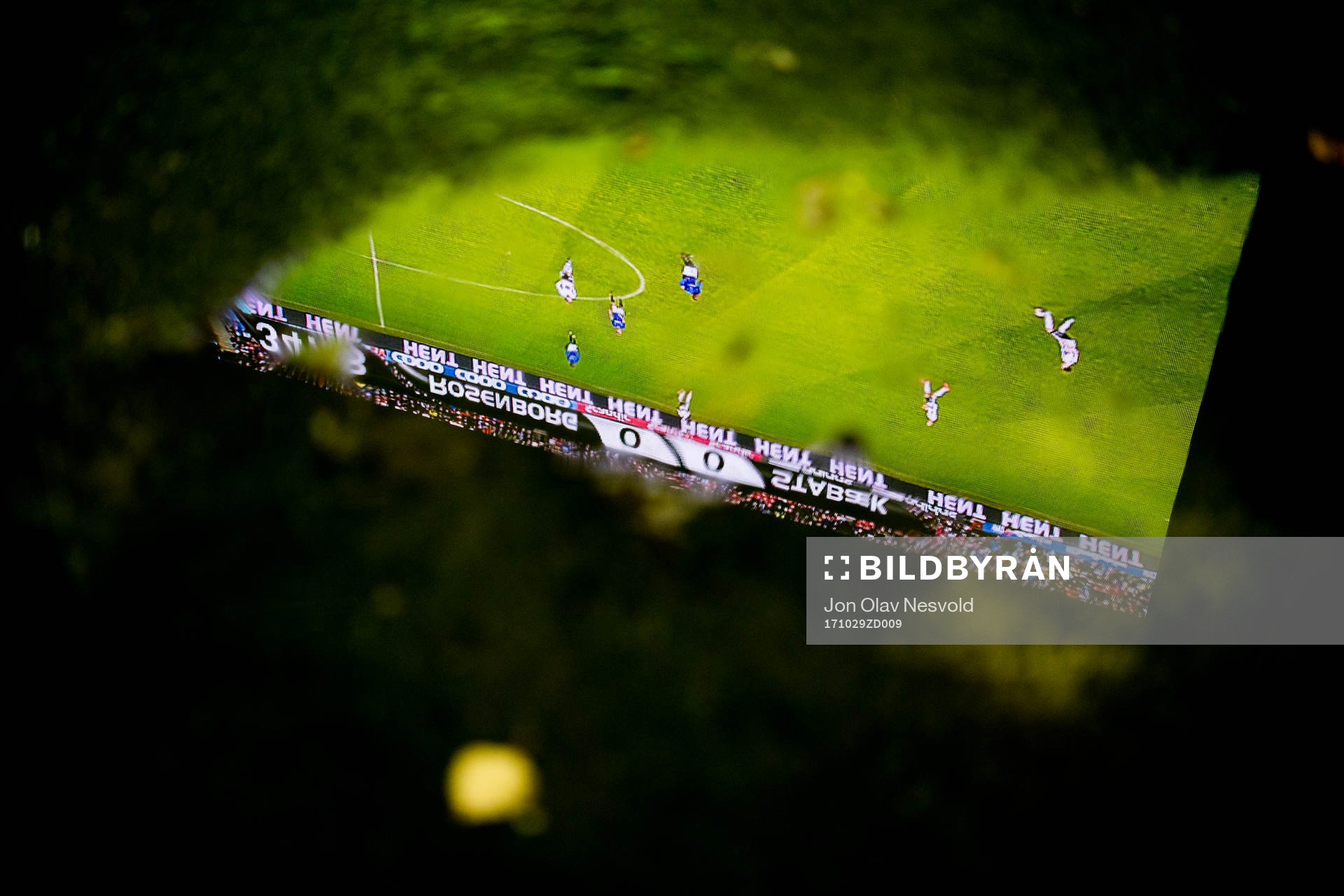 The big screen at Lerkendal stadion seen through a puddle