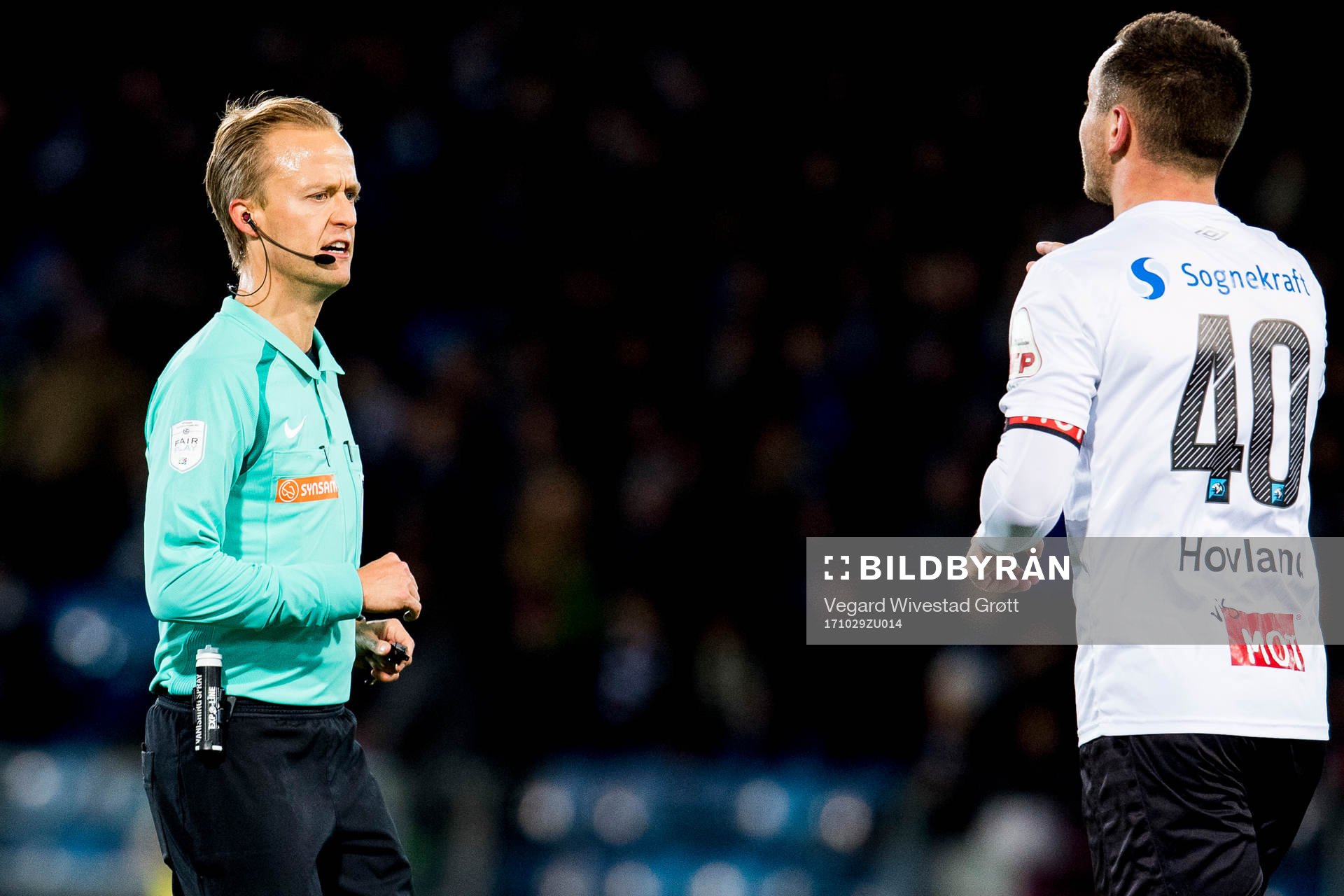 Referee Ola Hobber Nilsen talks to Even Hovland of Sogndal