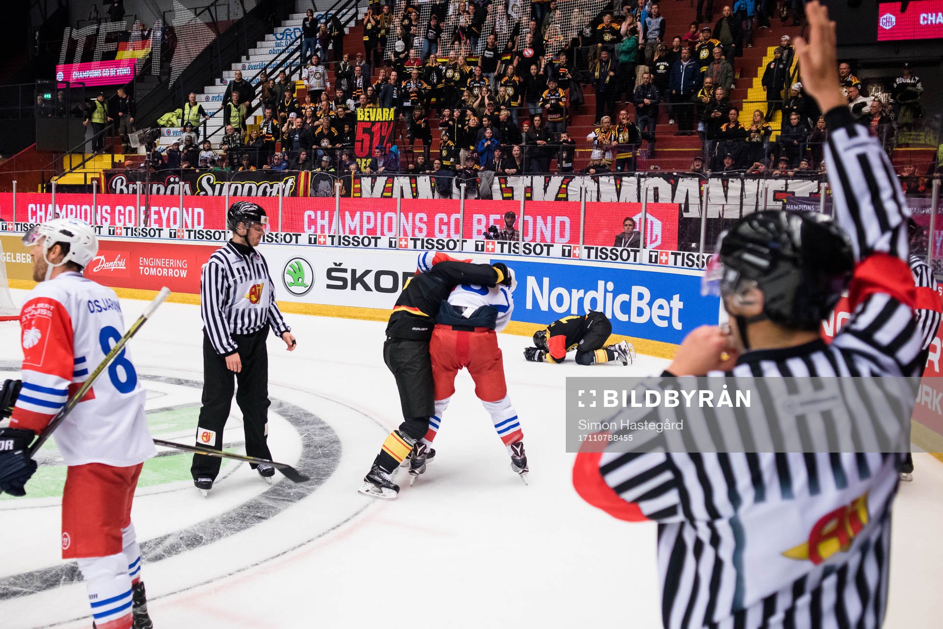 Lukas Kilström of Brynäs fights Thomas Larkin of Adler