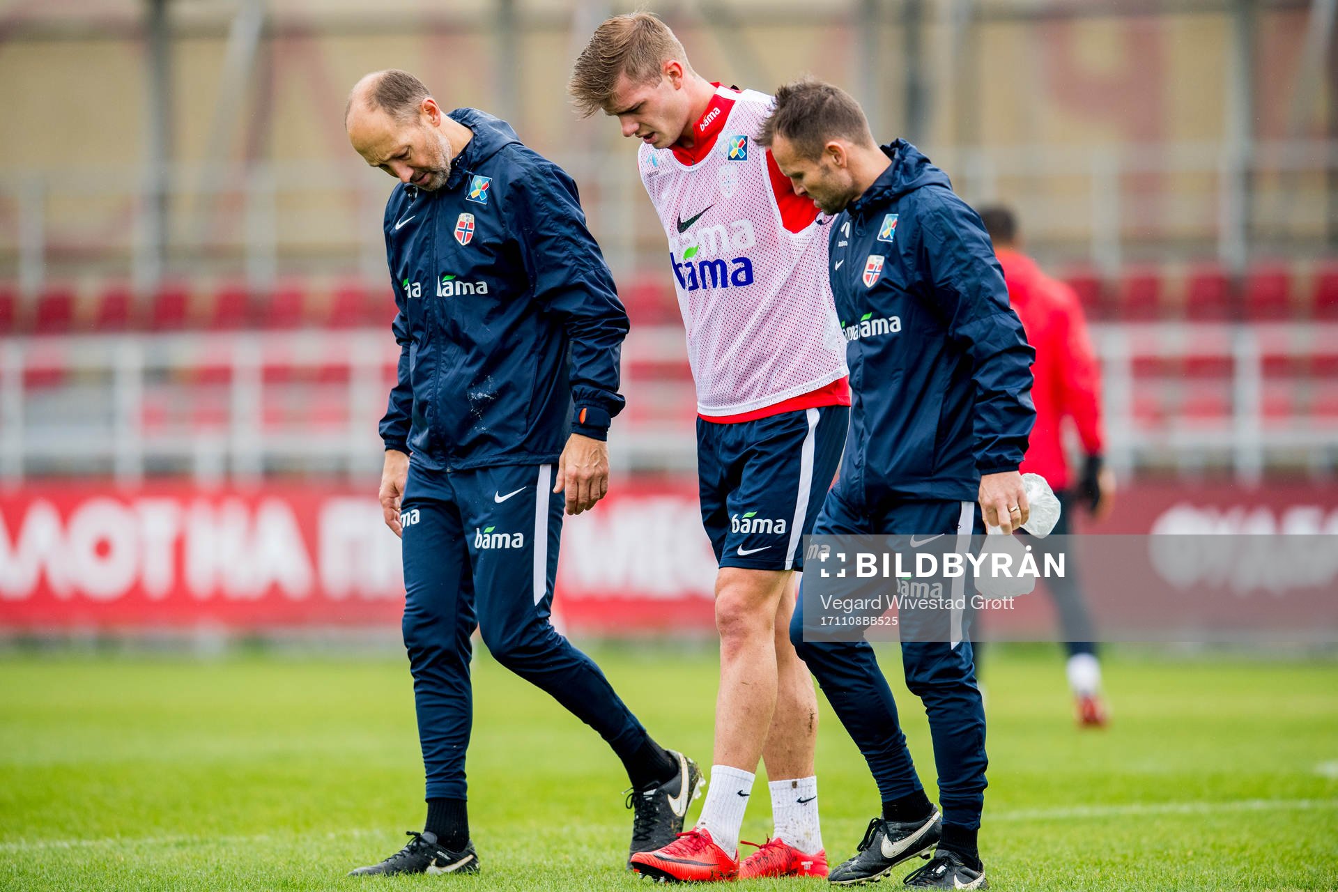 Alexander Sørloth of Norway is helped off the pitch by