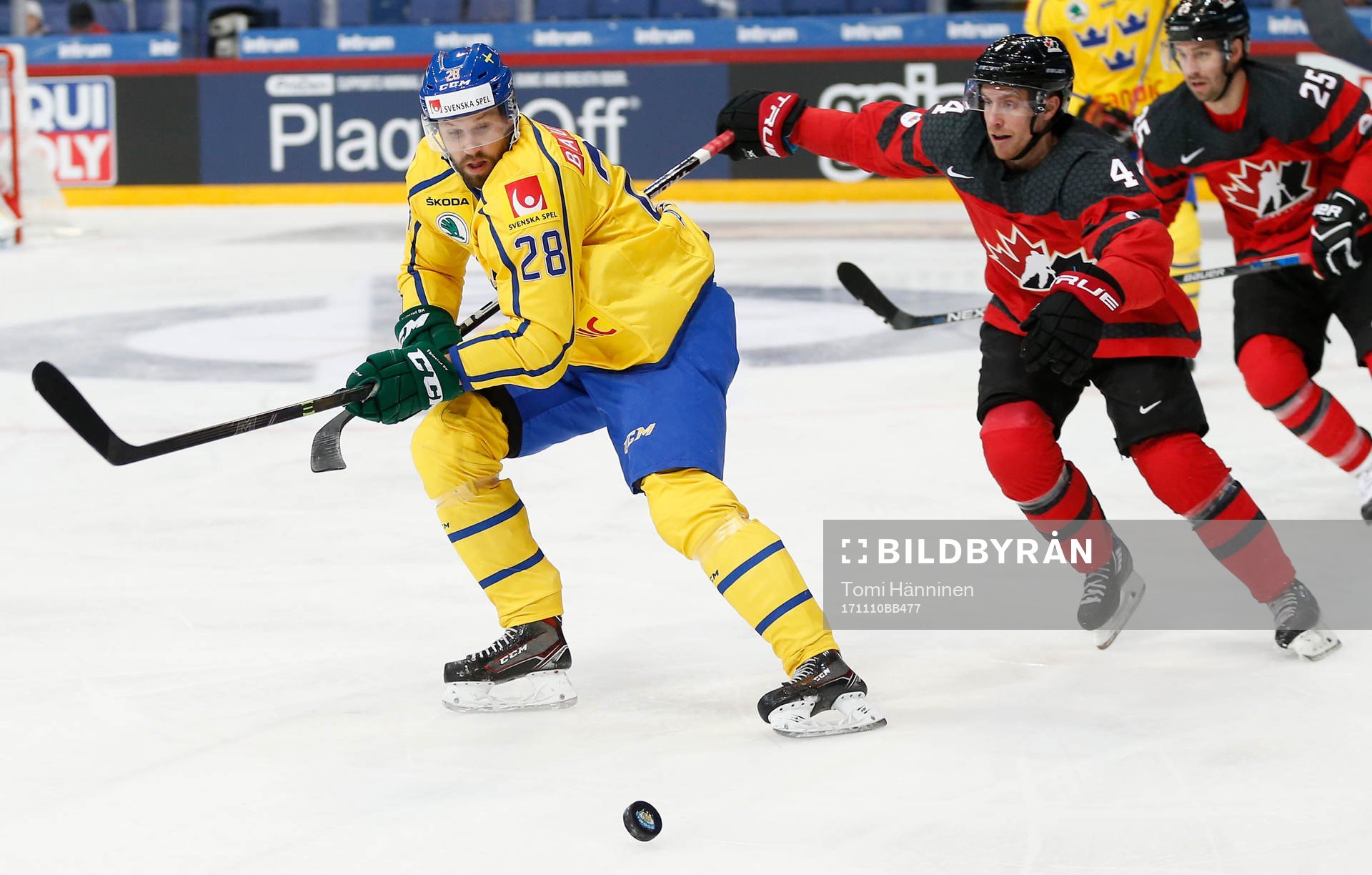 Dick Axelsson #28, Sweden and	Charles Genoway #4, Canada