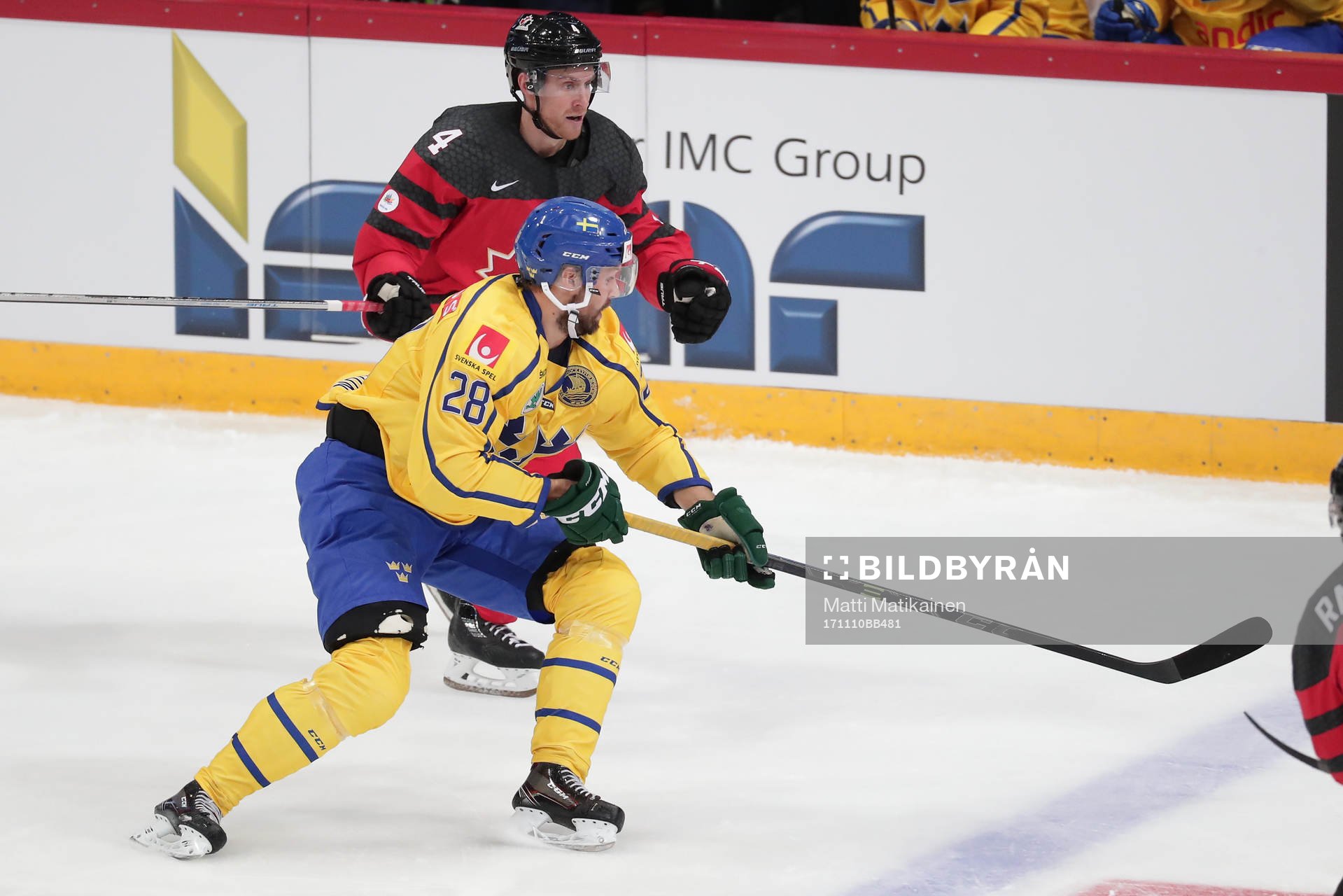 Dick Axelsson #28, Sweden and	Charles Genoway #4, Canada