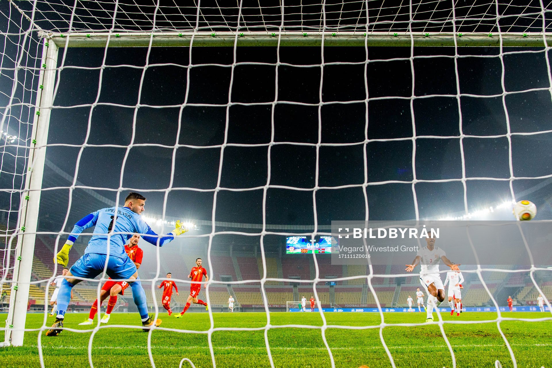 Goalkeeper Stole Dimitrevski of Macedonia and Ola Kamara of