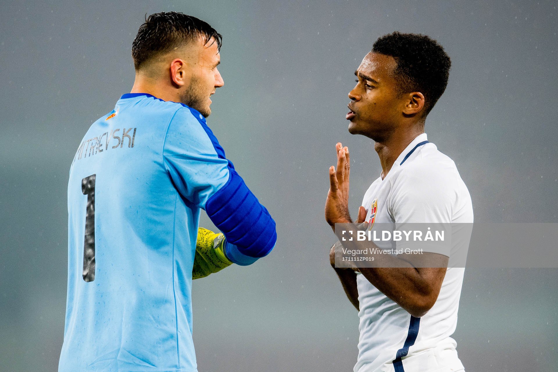 Goalkeeper Stole Dimitrevski of Macedonia and Ola Kamara of