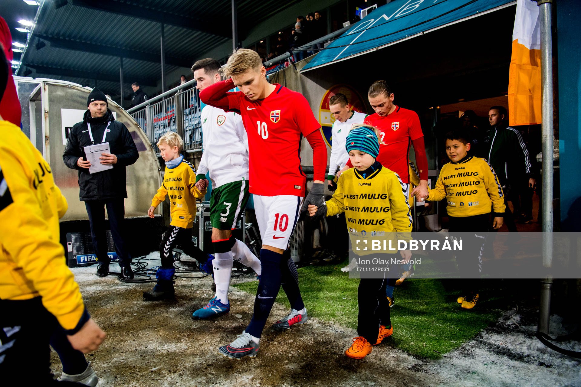 Martin Ødegaard and Julian Ryerson of Norway enter the