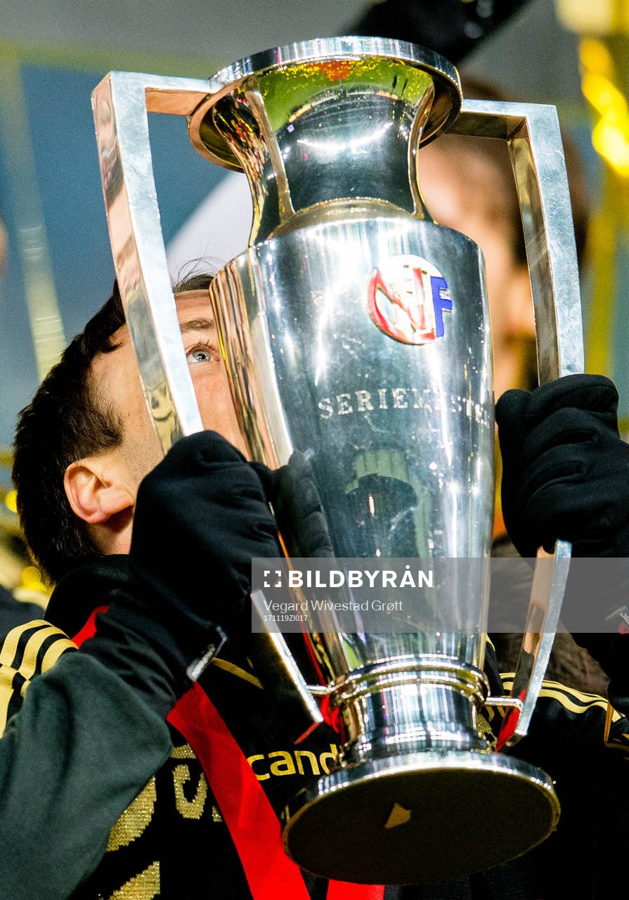 Mike Jensen of Rosenborg kisses the league trophy after the Eliteserien match between Rosenborg and Viking on November 19, 2017 in Trondheim.