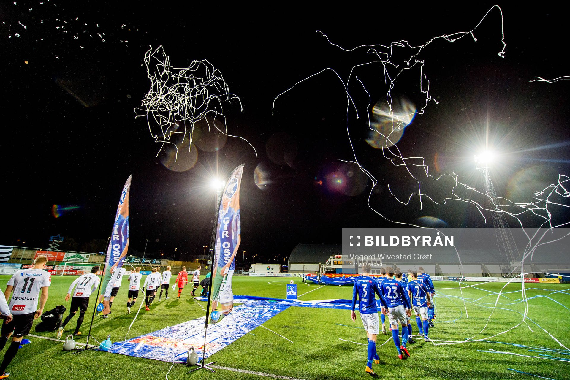 The teams enter the pitch