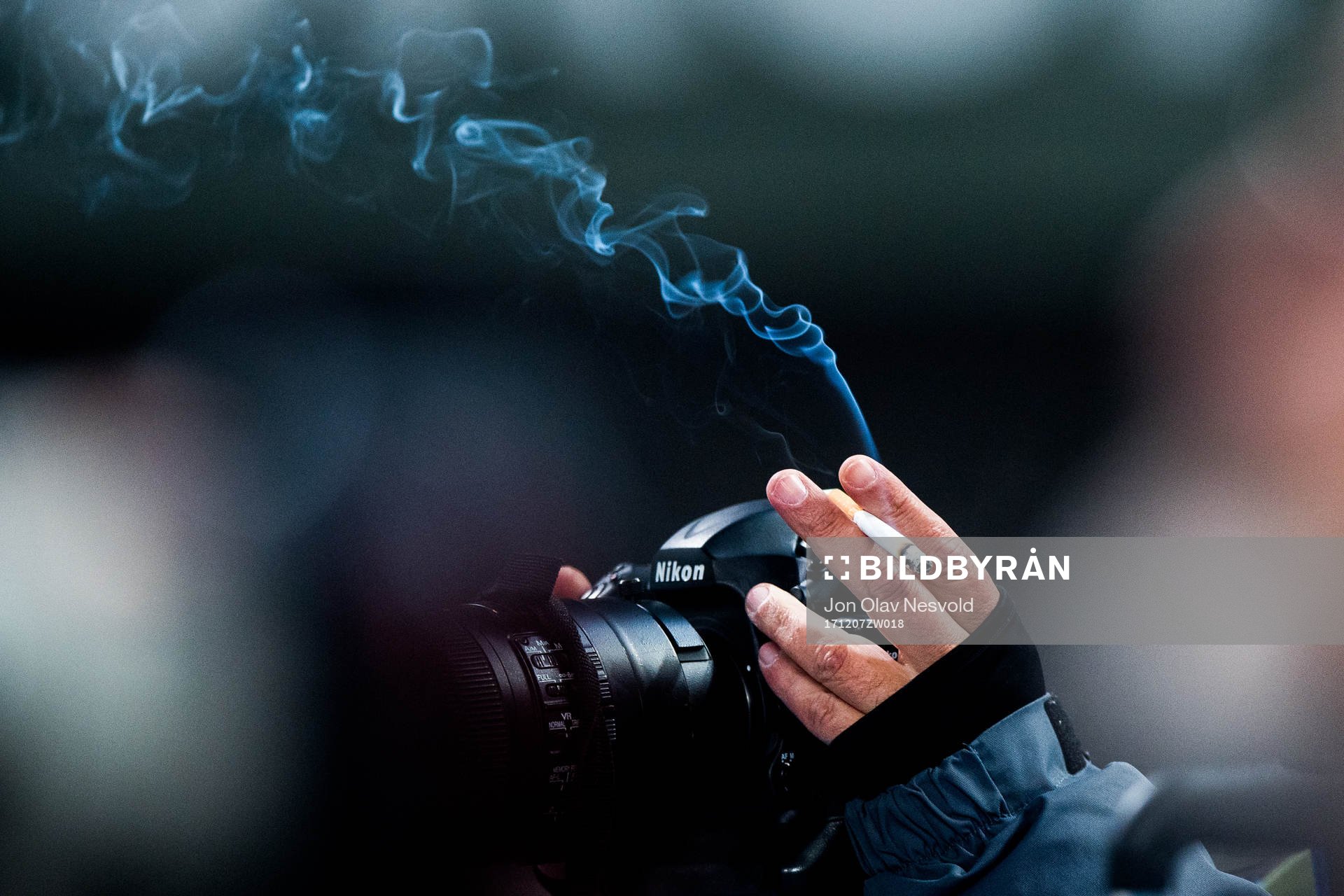 A photographer with a cigarette