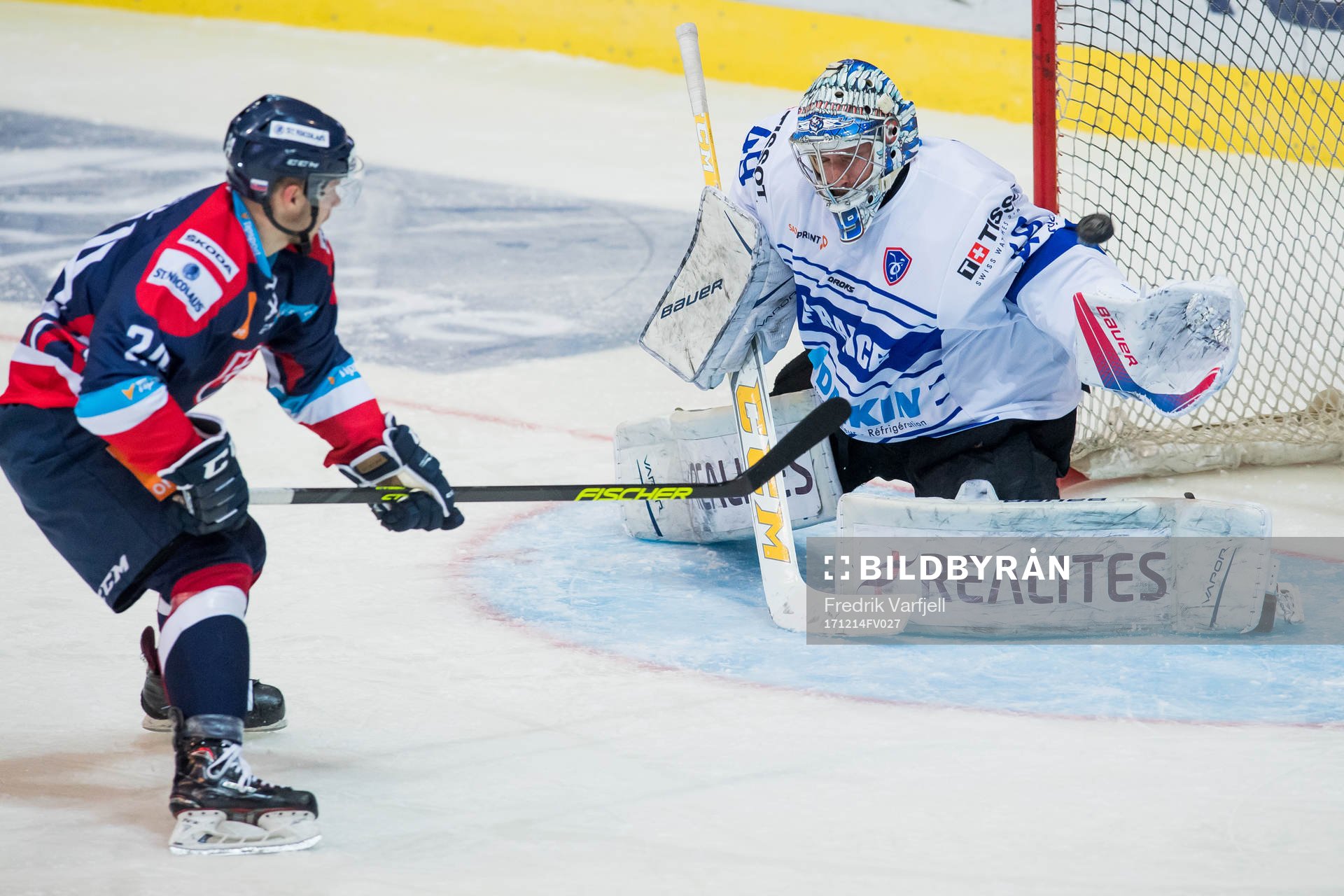 Matus Sukel of Slovakia and Goaltender Florian Hardy of