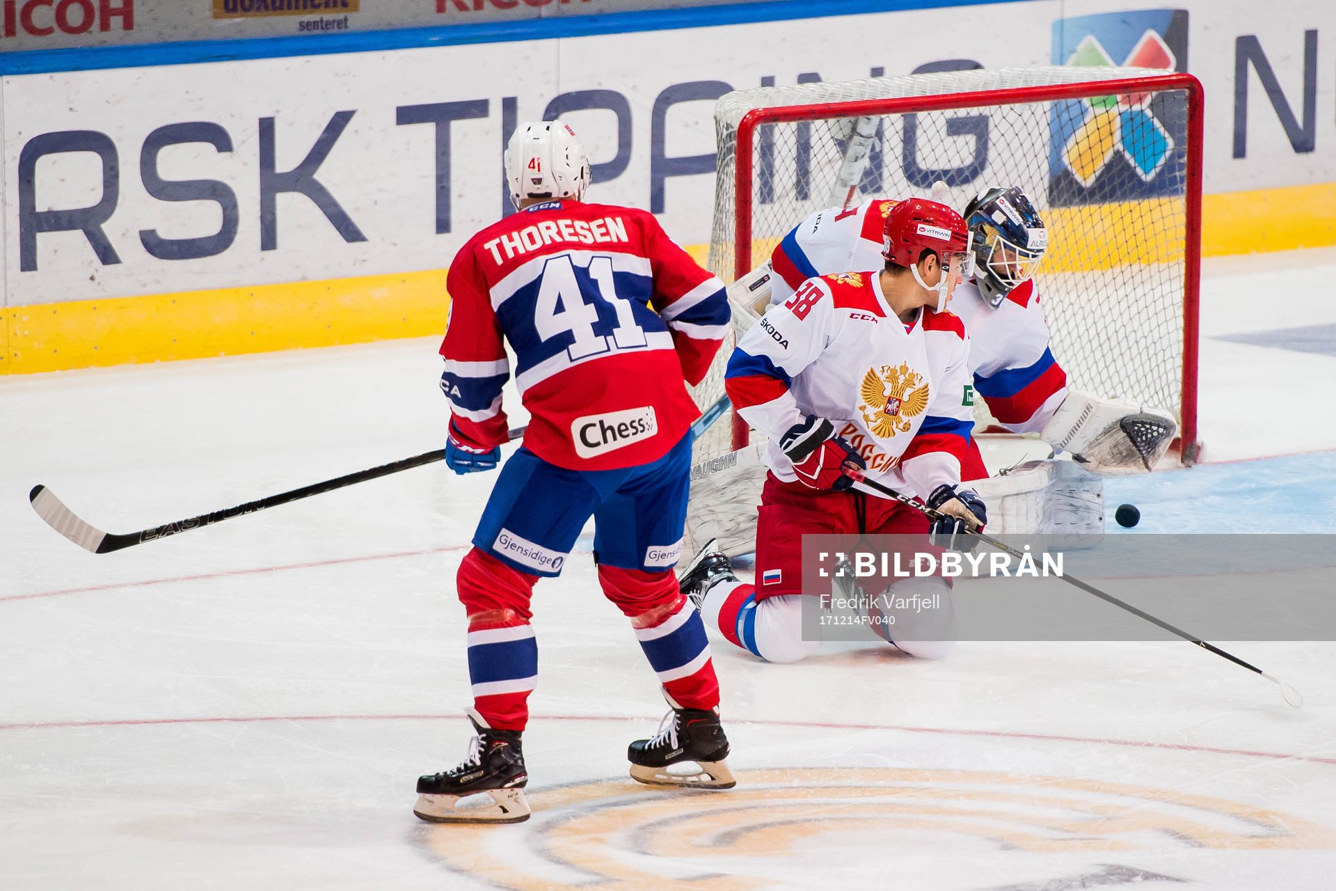 Patrick Thoresen of Norway scores 1-0 behind goaltender