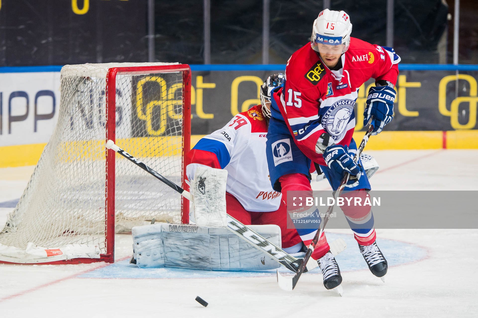 Goaltender Aleksandr Sharychenkov of Russia and Tommy