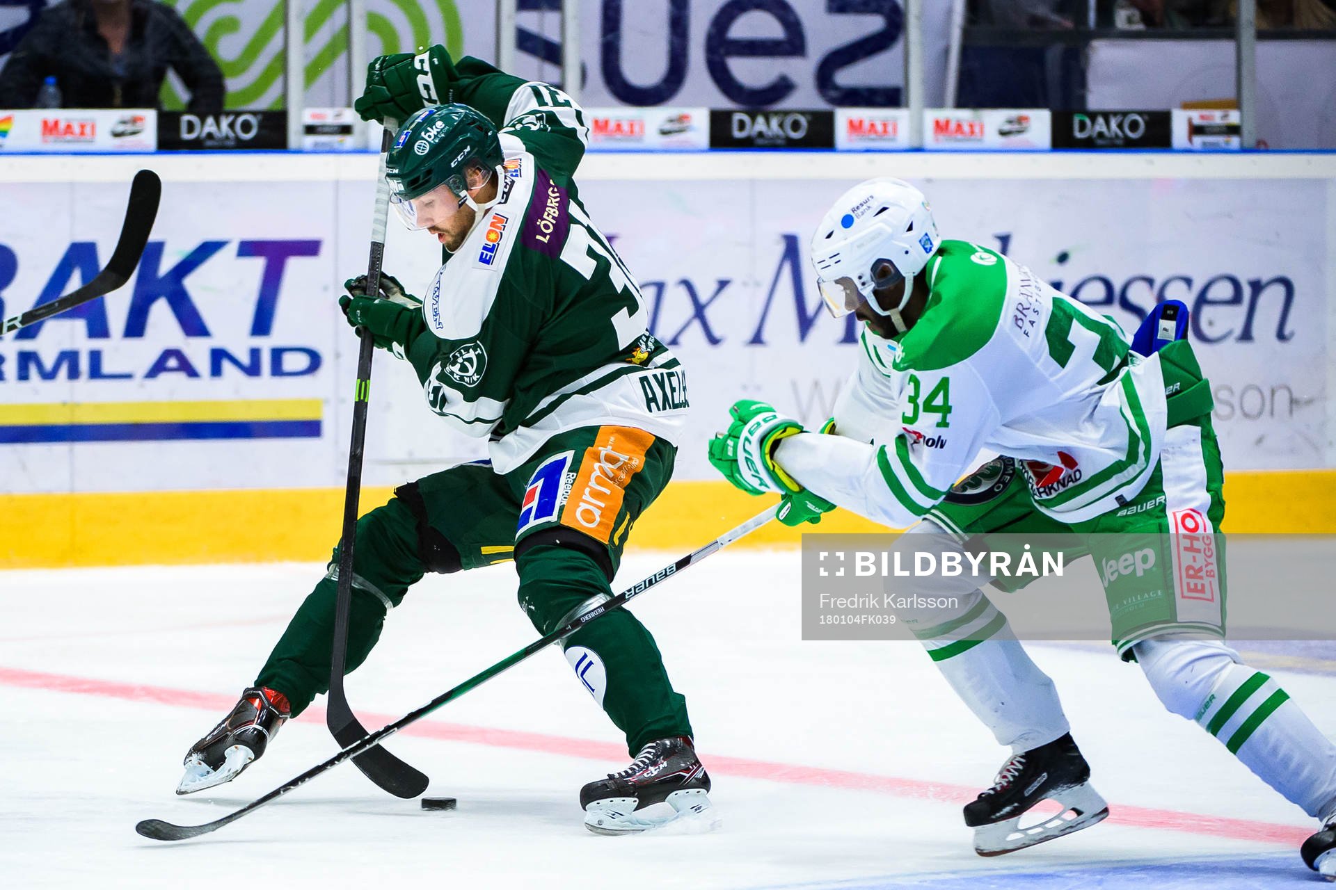 Färjestads Dick Axelsson och Rögles Edwin Hedberg