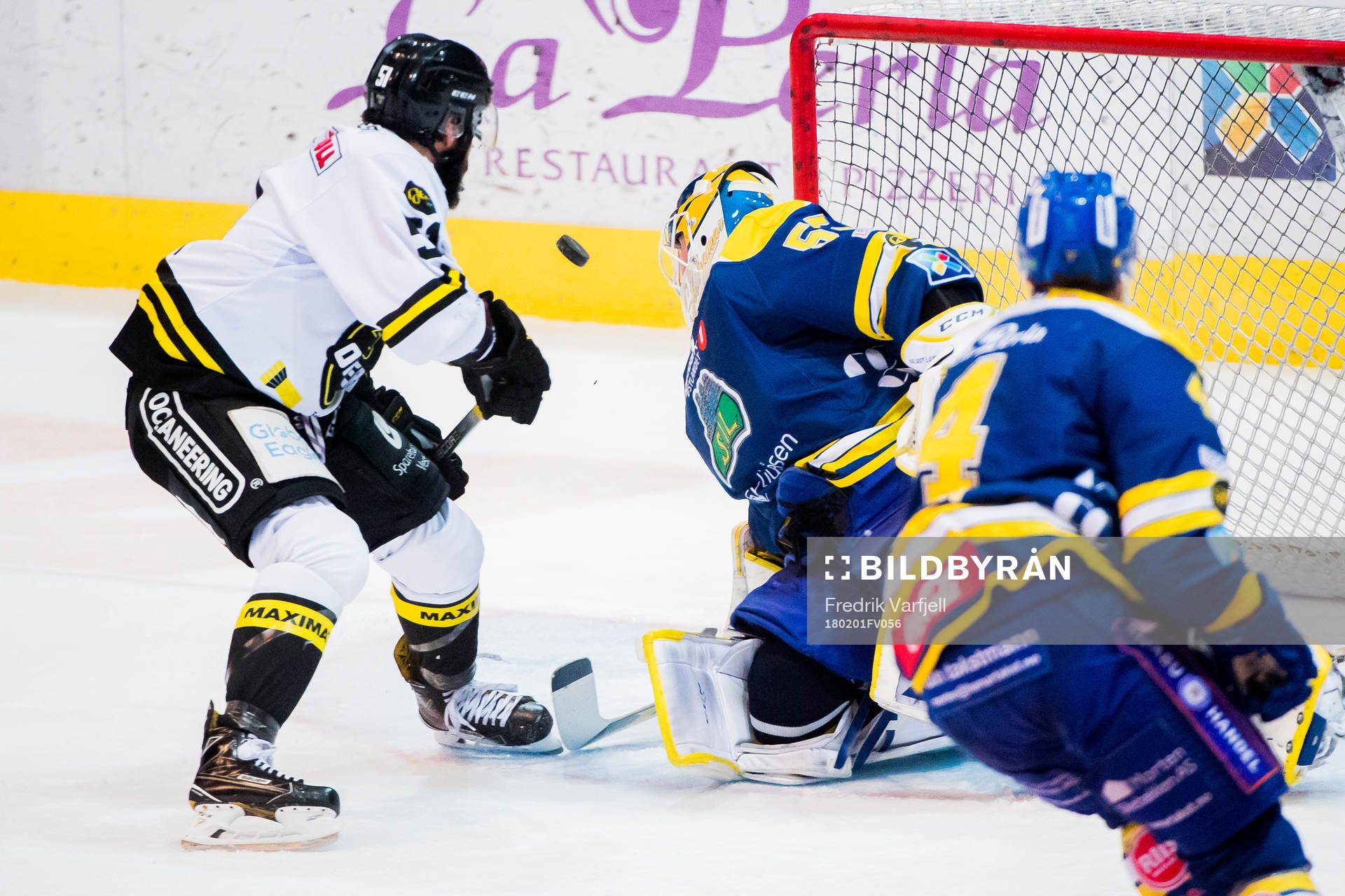 Philippe Cornet of Stavanger Oilers and goaltender Oskar