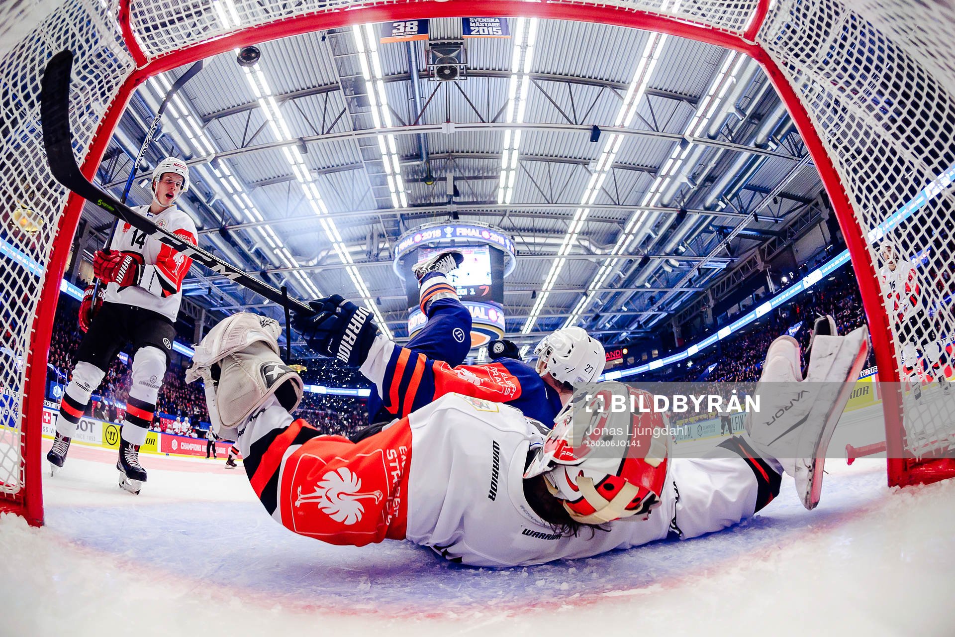Martin Lundberg of Växjö falls into goals Juho Olkinuora