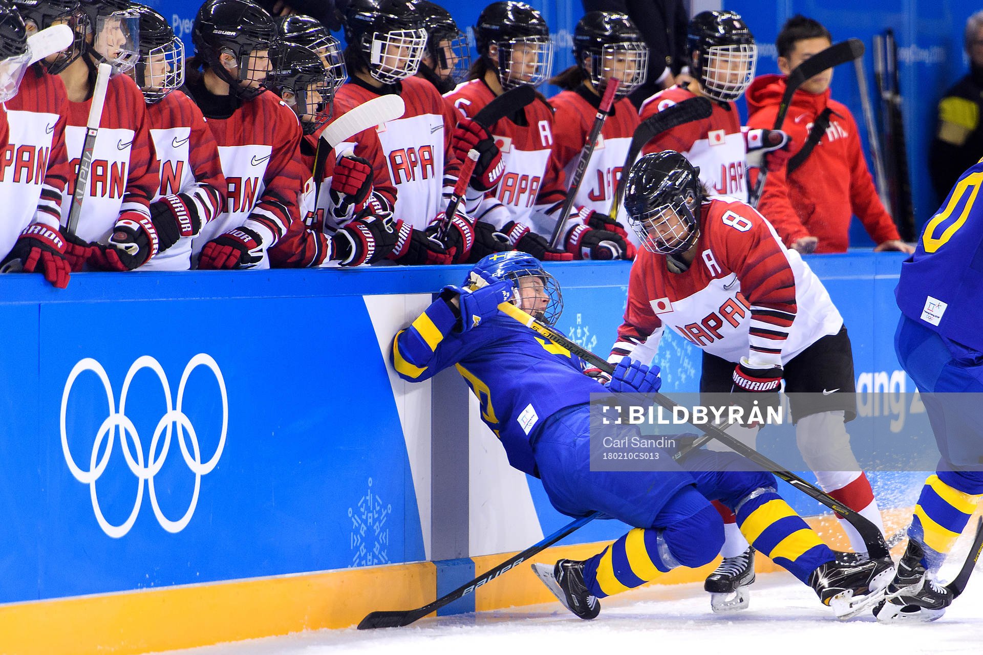 A Swedish player is run over by Akane Hosoyamada of Japan