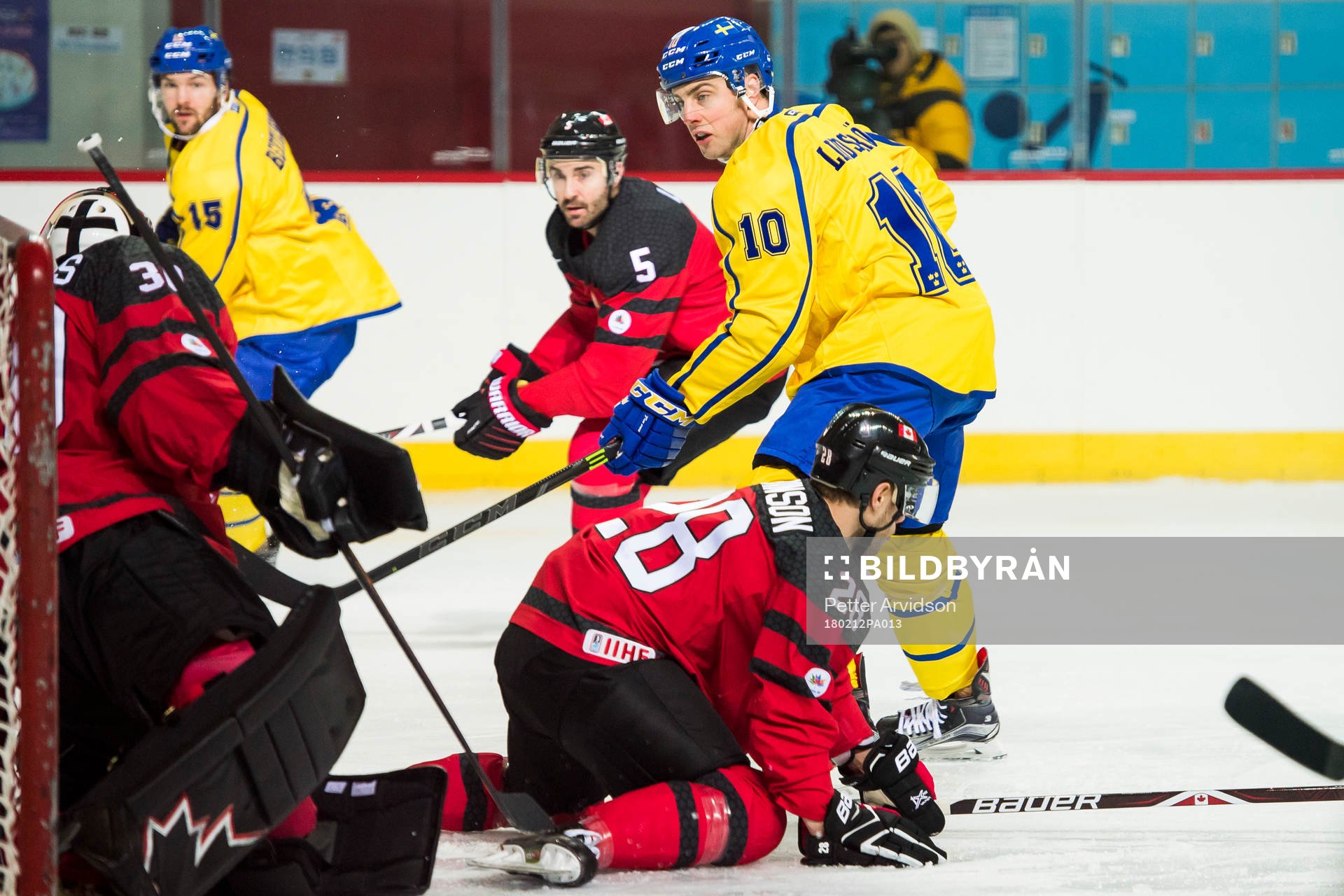 Joakim Lindström of Sweden and Goaltender Ben Scrivens of