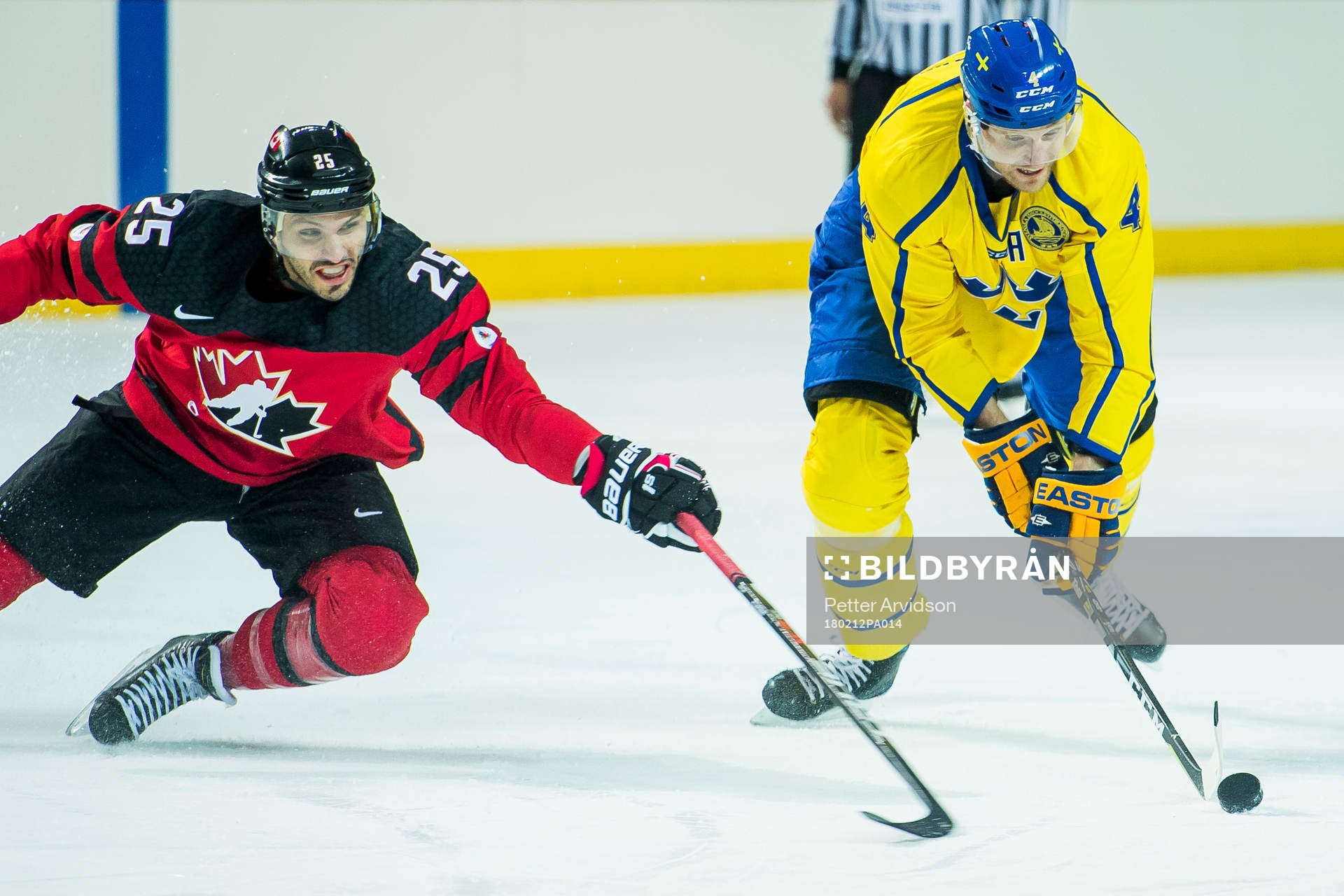 Maxim Lapierre of Canada and Staffan Kronwall of Sweden