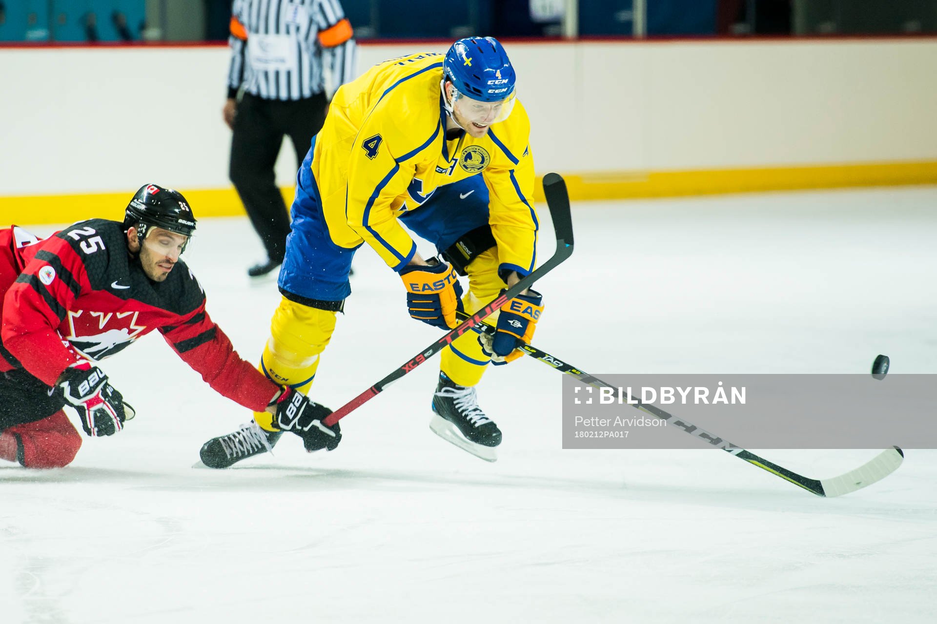 Maxim Lapierre of Canada and Staffan Kronwall of Sweden