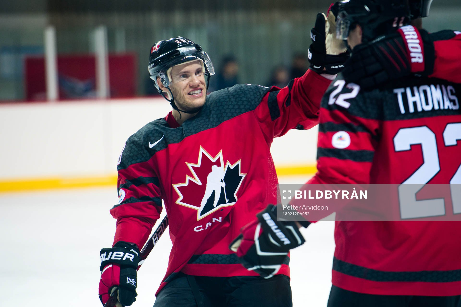 Christian Thomas of Canada celebrates with Mat Robinson