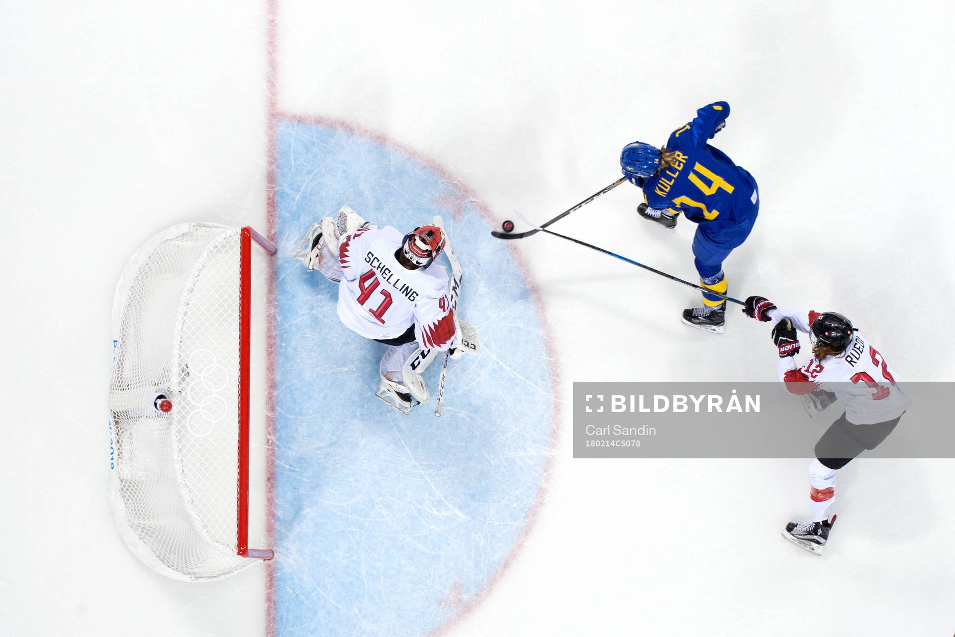 Sabina Küller of Sweden with puck in front of Goaltender