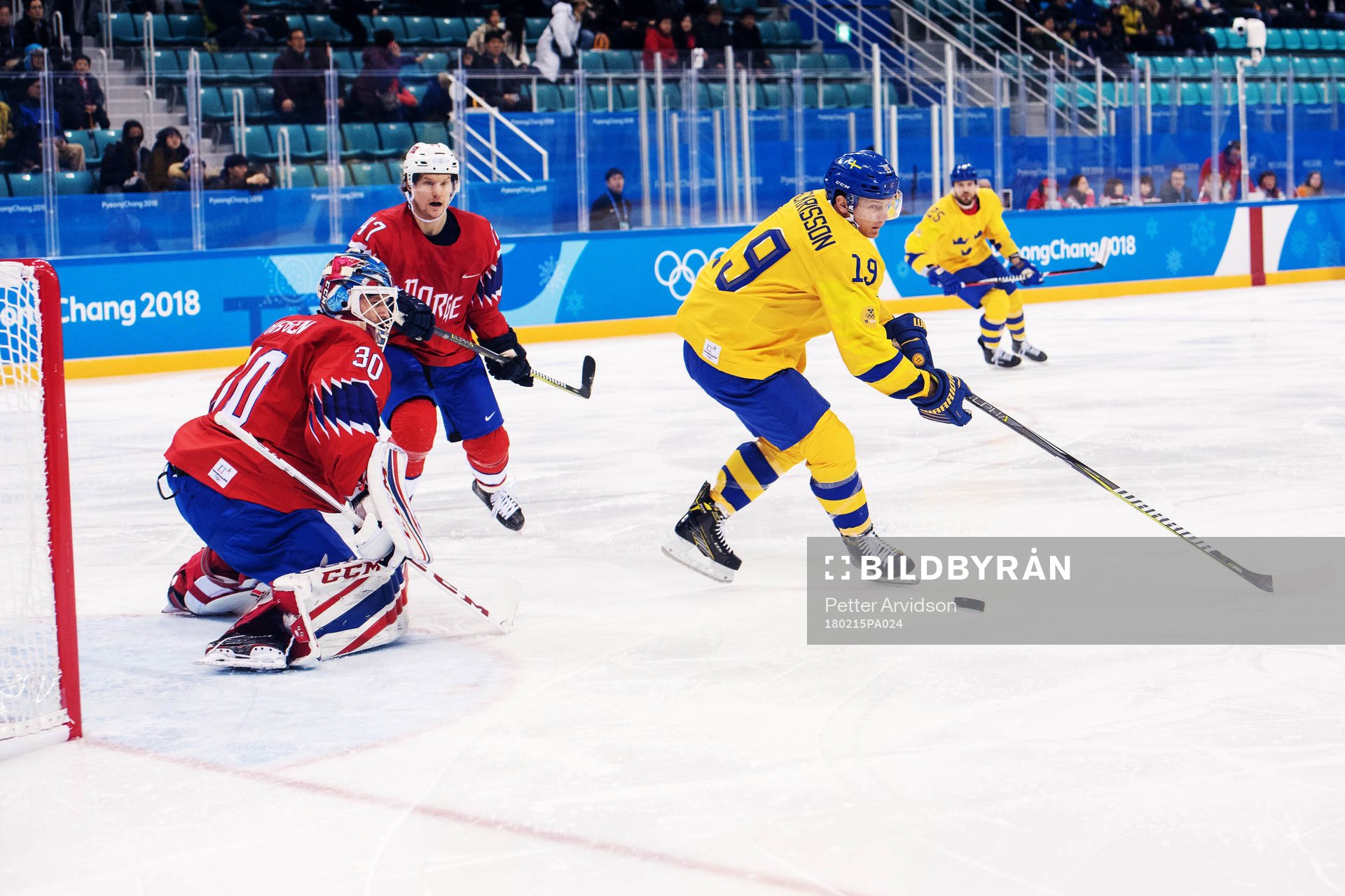 Patrik Zackrisson of Sweden in front of Goaltender Lars