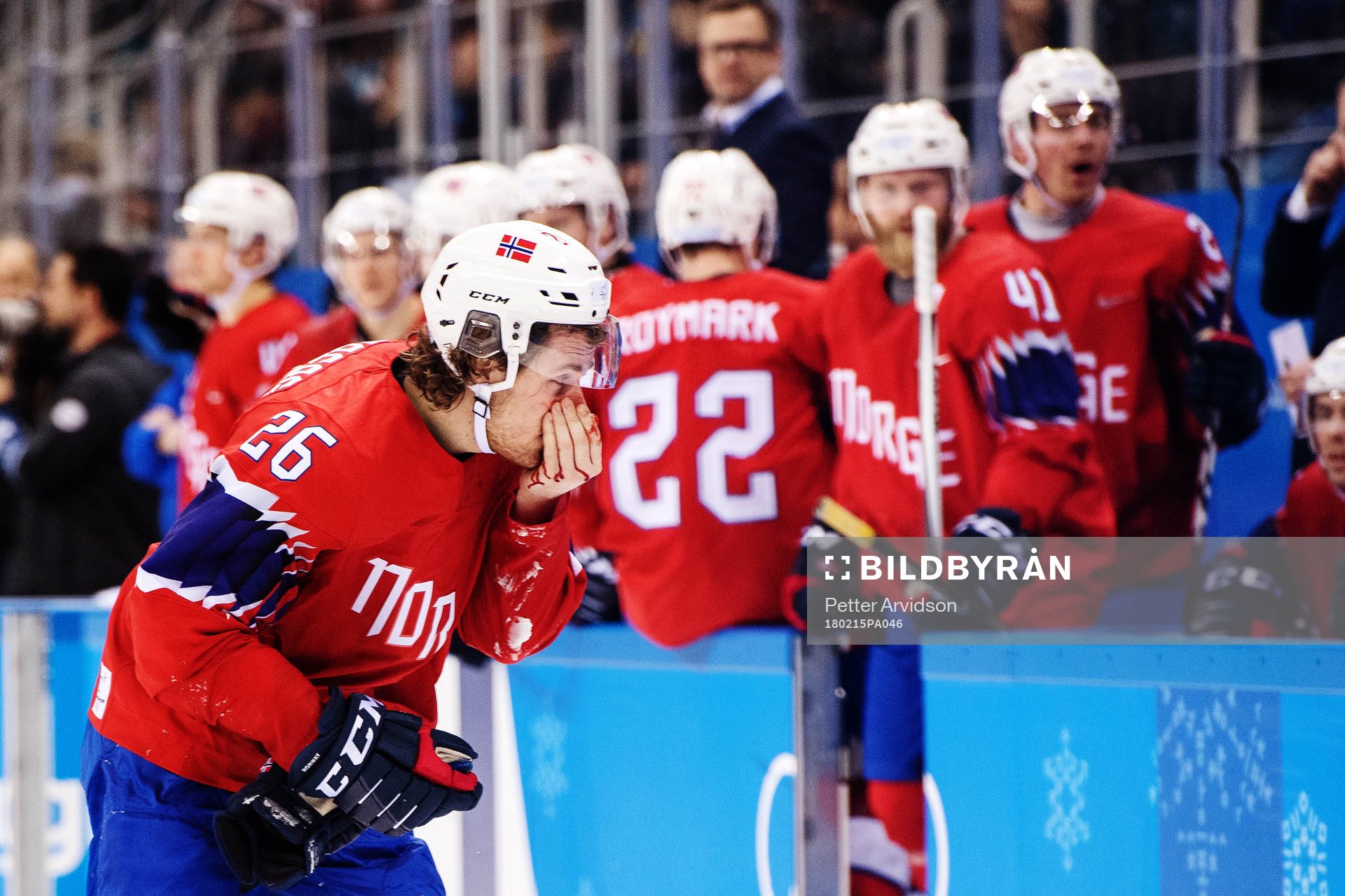Kristian Forsberg of Norway bleeds in the Men's Ice Hockey