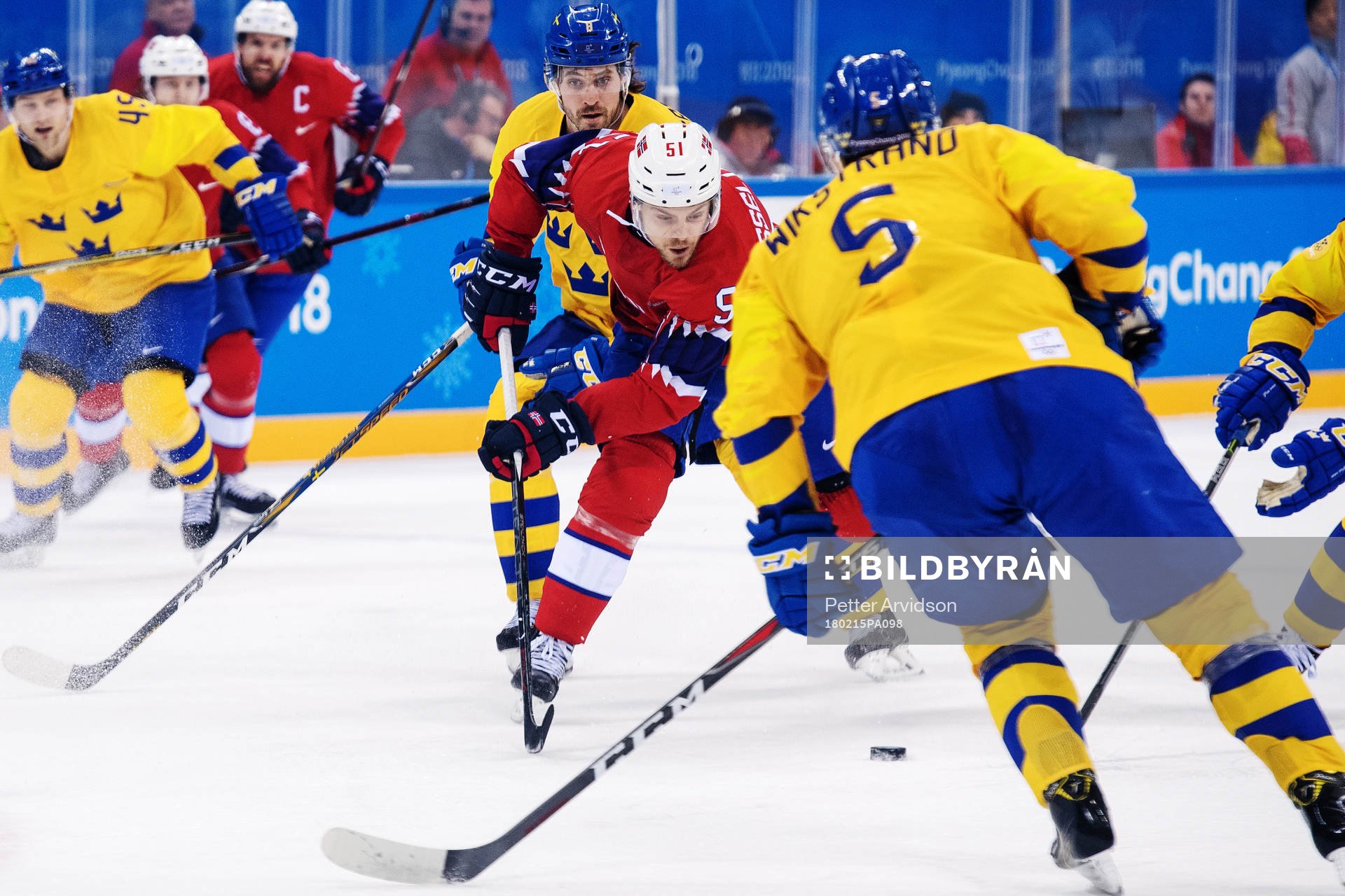 Mats Rosseli Olsen of Norway with the puck in the Men's Ice