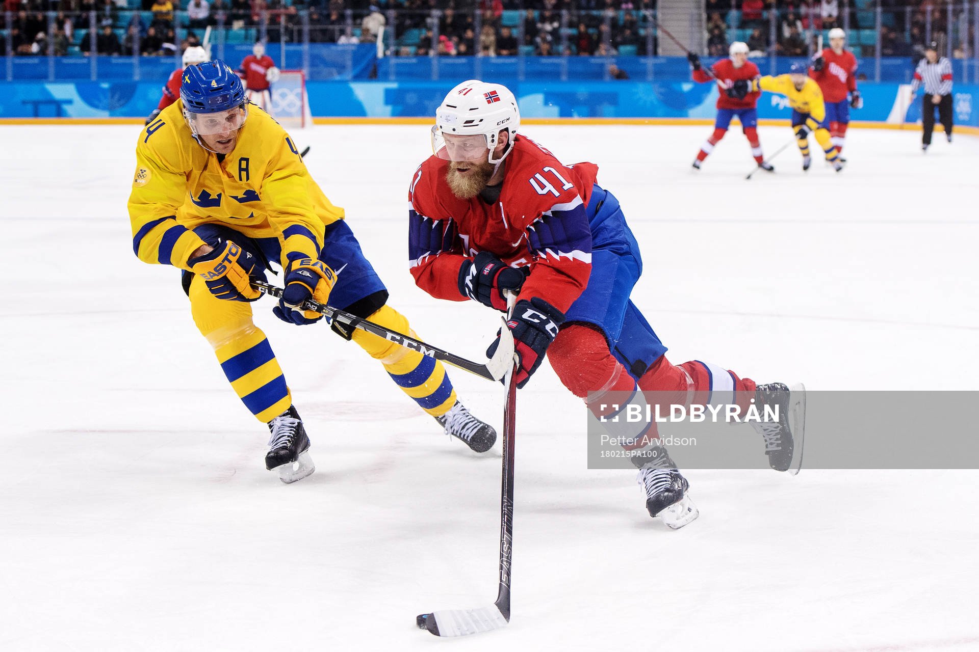 Staffan Kronwall of Sweden defends against Patrick Thoresen