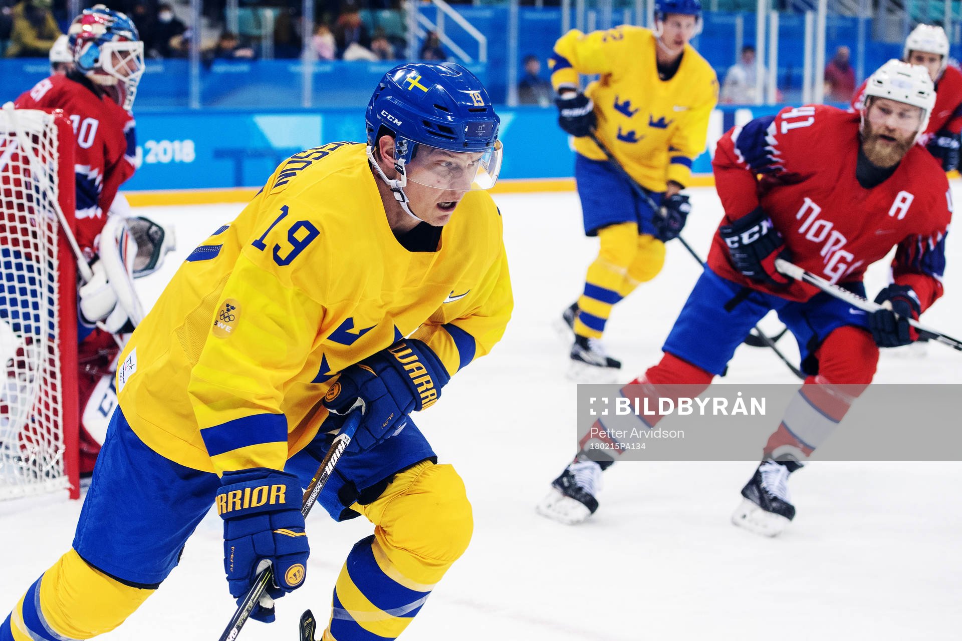 Patrik Zackrisson of Sweden compete for the puck in the