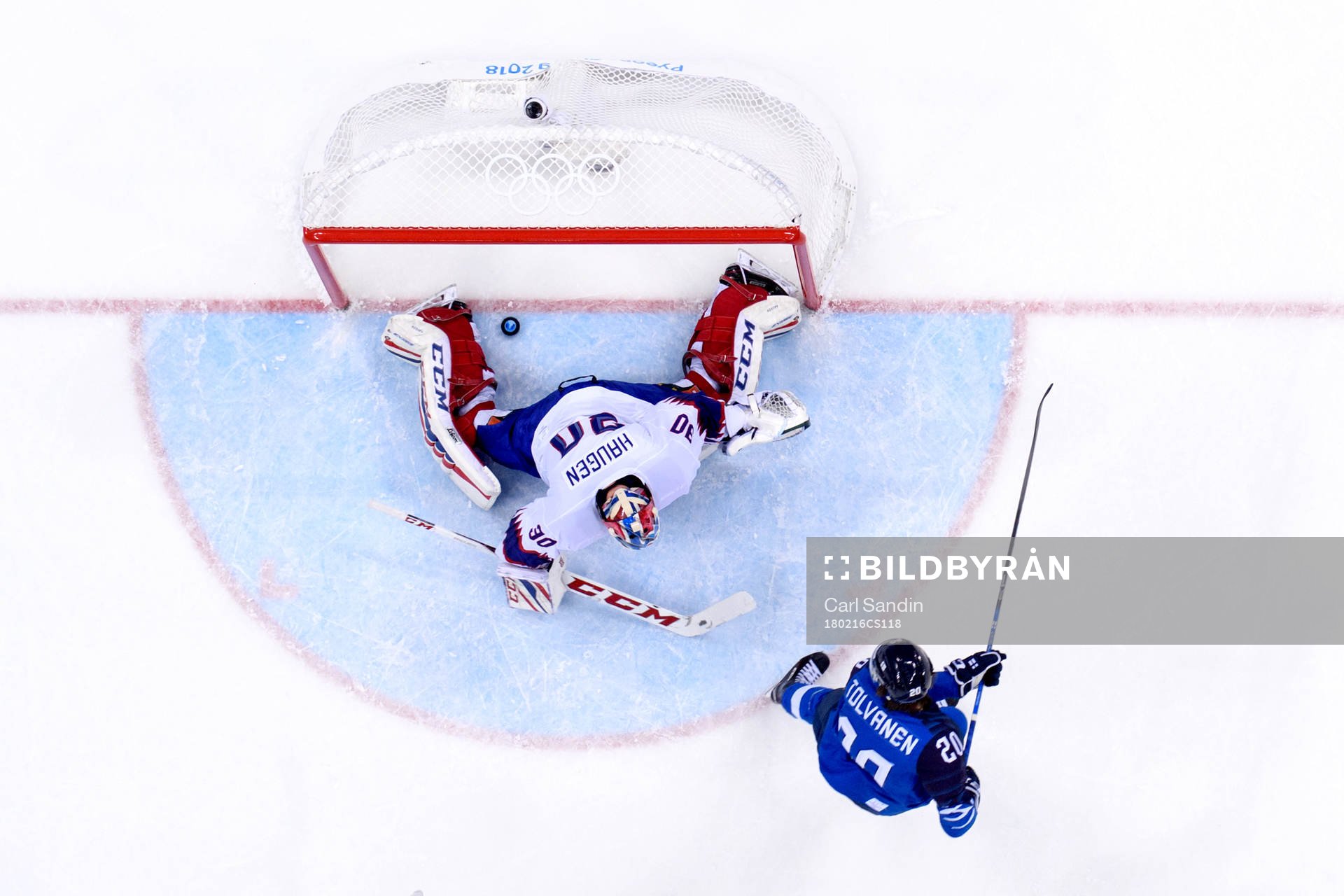 Eeli Tolvanen of Finland scores 2-1 behind goaltender Lars