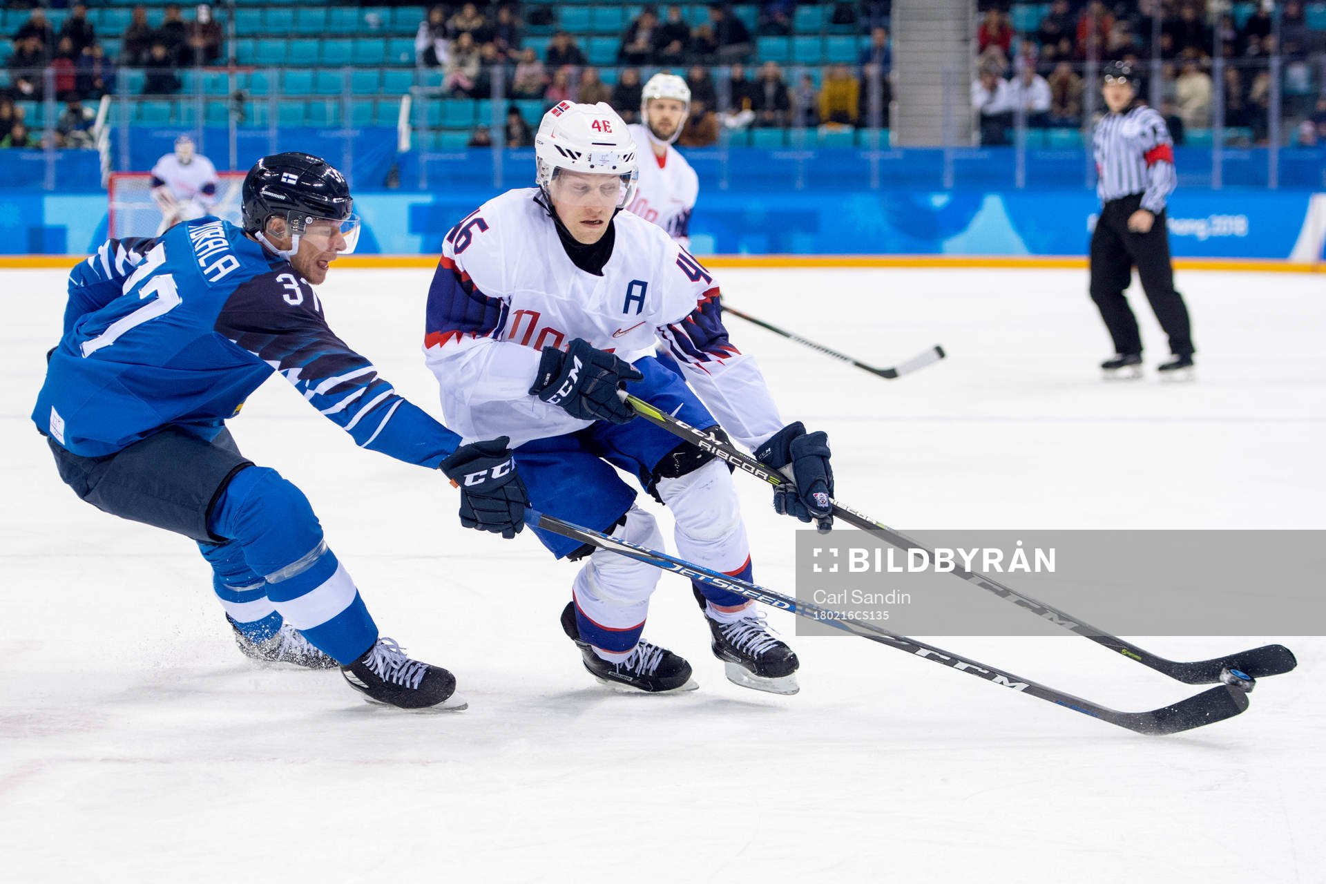 Mika Pyorala of Finland and Mathis Olimb of Norway in the