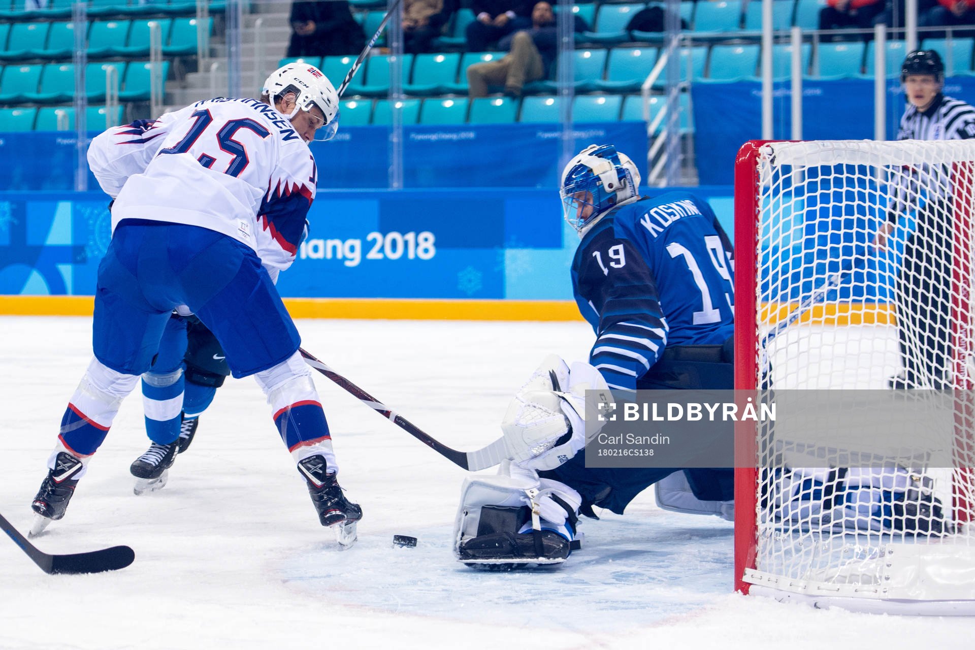 Tommy Kristiansen of Norway and Goaltender Mikko Koskinen
