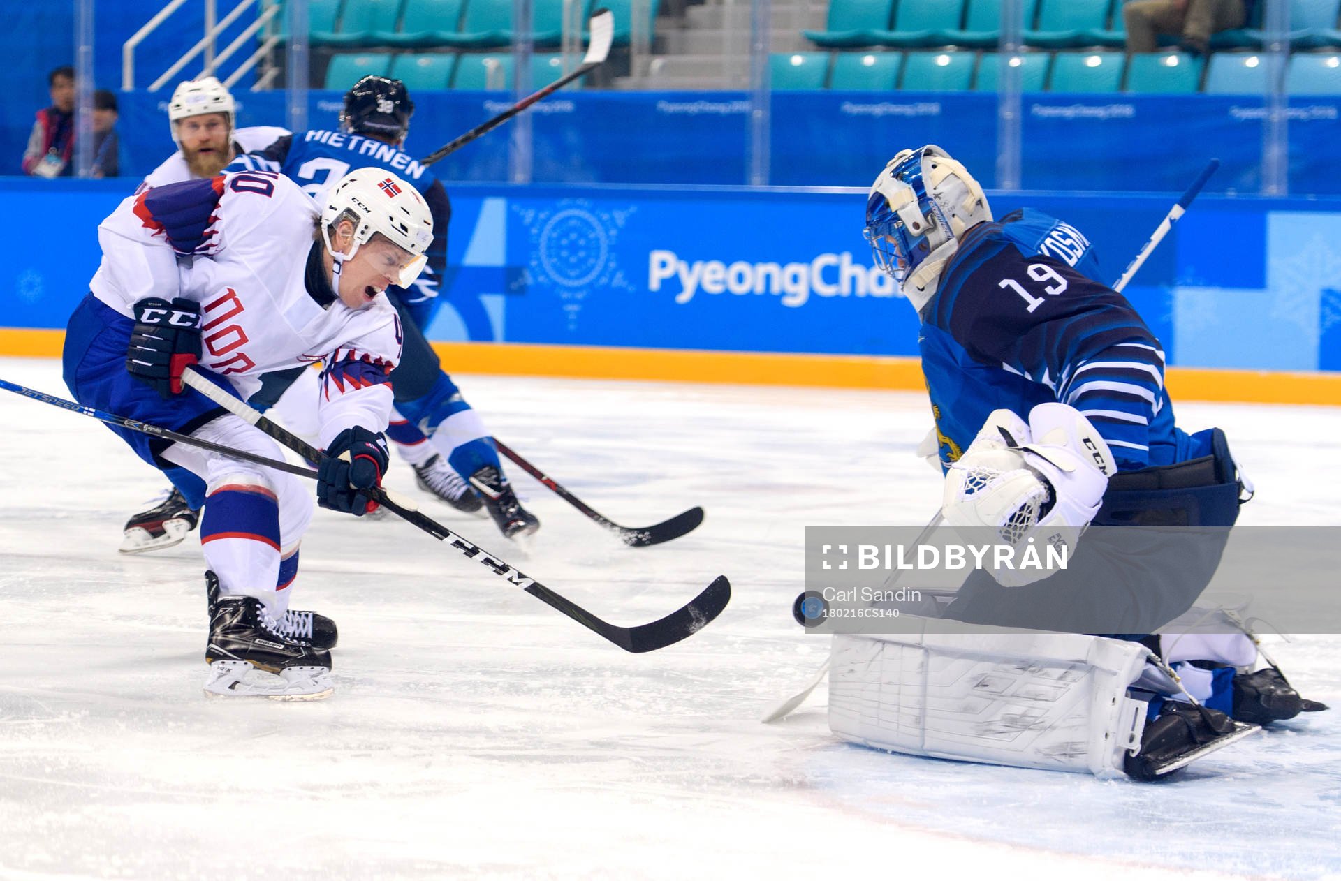 Ken André Olimb of Norway against Goaltender Mikko