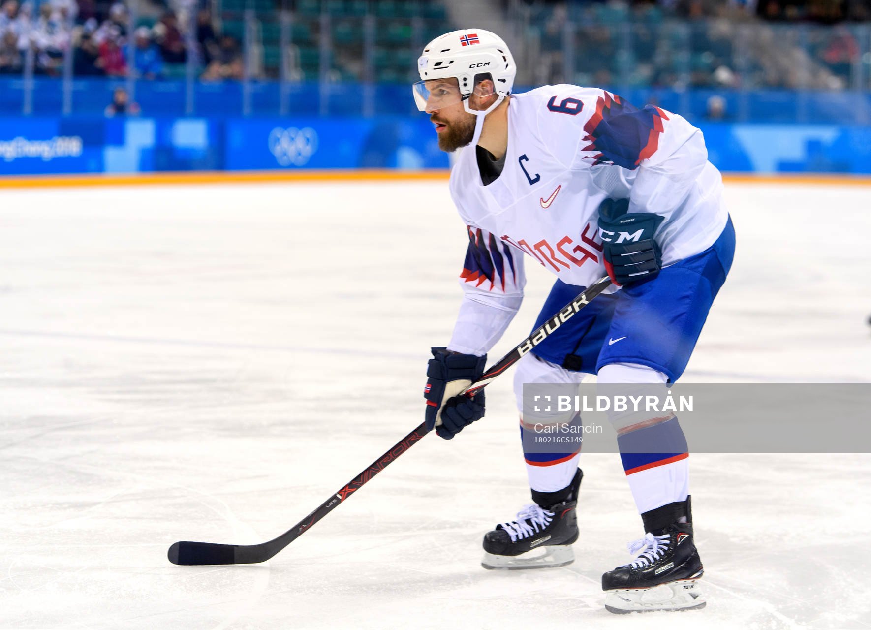 Jonas Holøs of Norway in the ice hockey game between