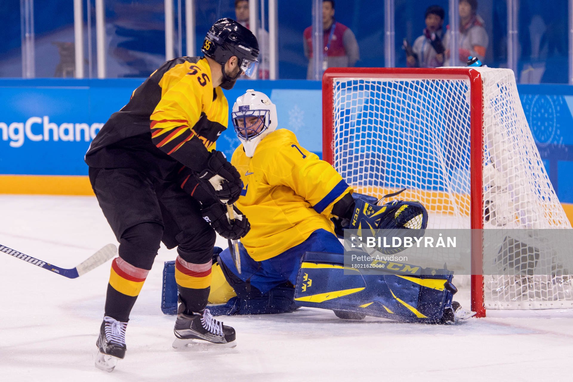 Goaltender Jhonas Enroth of Sweden and Felix Schutz of
