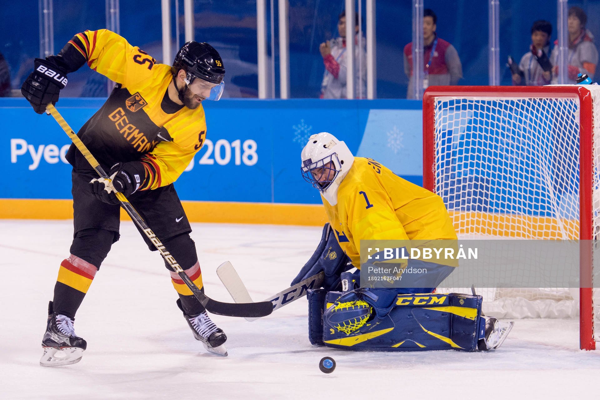 Felix Schutz of Germany and Goaltender Jhonas Enroth of