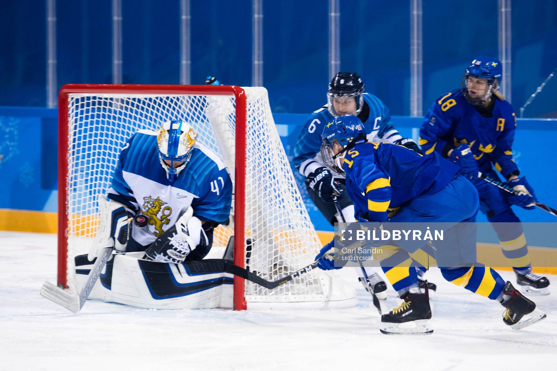 Lisa Johansson of Sweden against Goaltender Noora Raty of