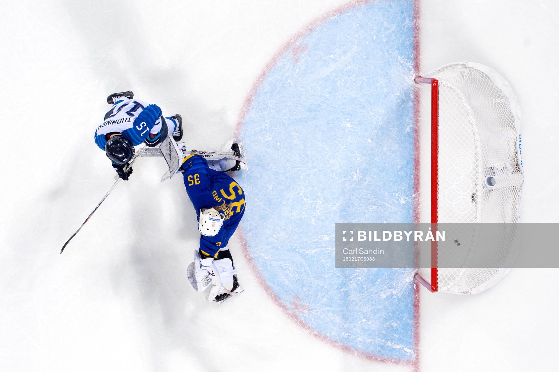 Finland scores a goal behind Goaltender Sarah Berglind of