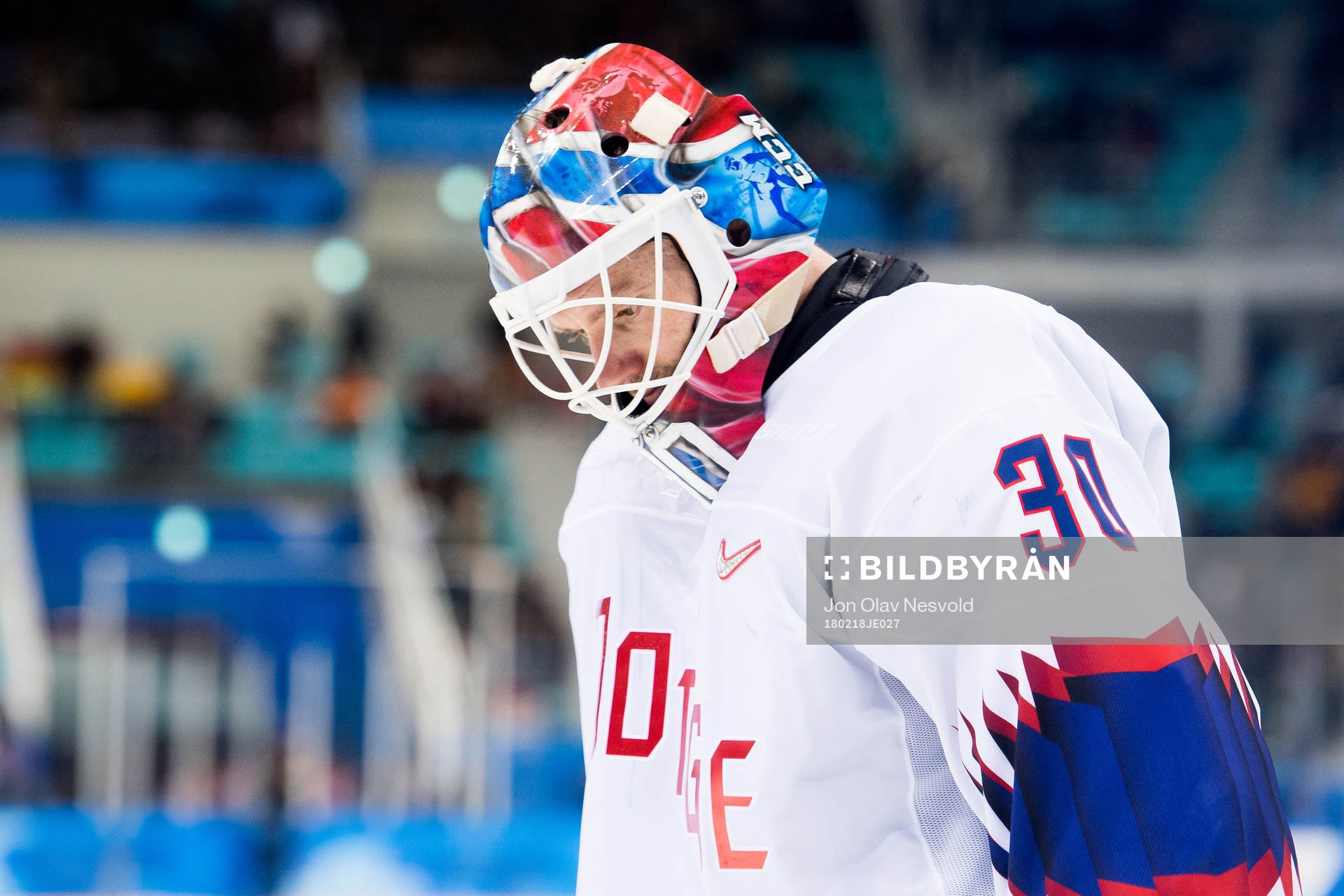 Goaltender Lars Haugen of Norway looks dejected in the
