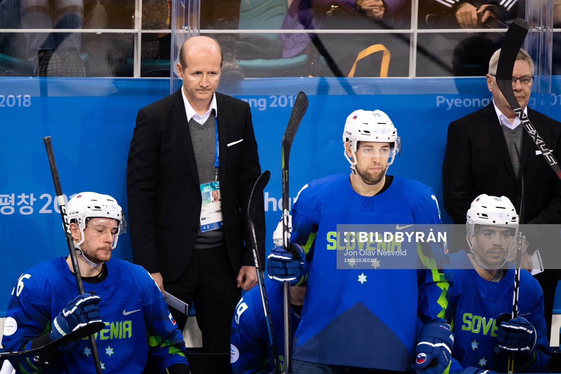 Team Slovenia  looks dejected in the Men's Ice Hockey