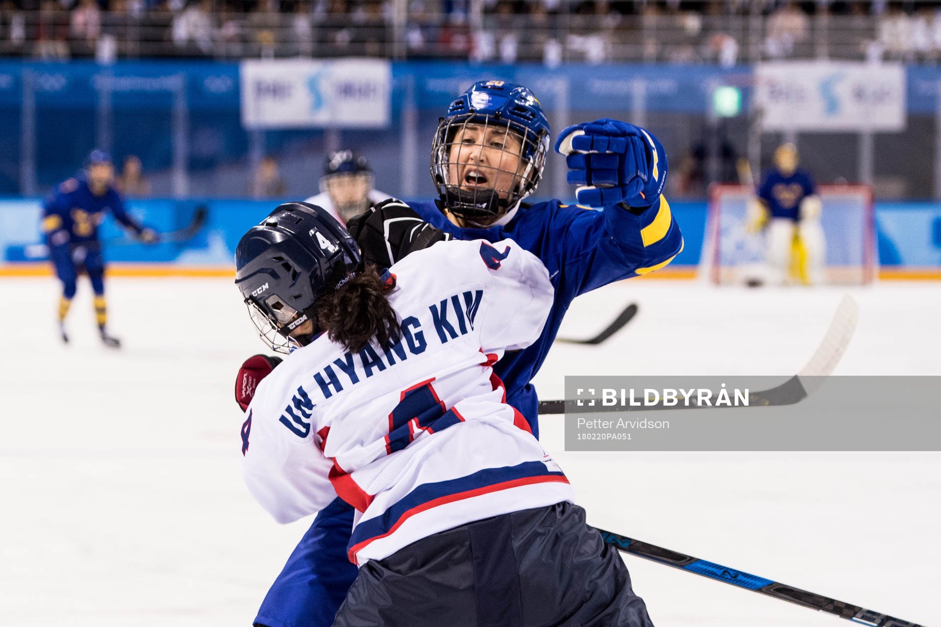 Fanny Rask of Sweden in action with Kim Un Hyang of Korea