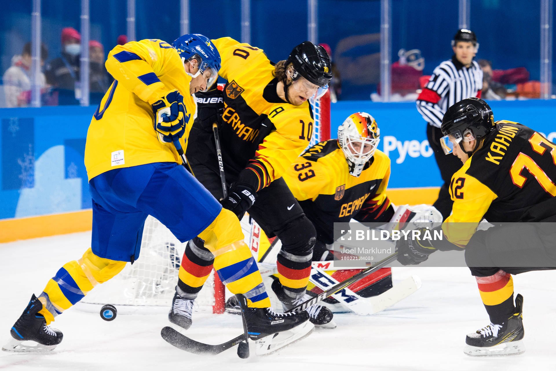 Joel Lundqvist of Sweden in action with Christian Ehrhoff,