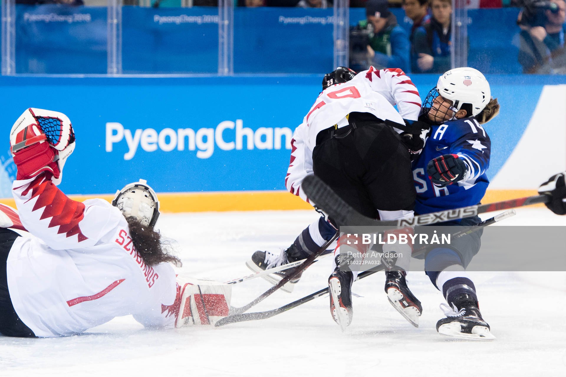 Marie-Philip Poulin of Canada against Brianna Decker of USA