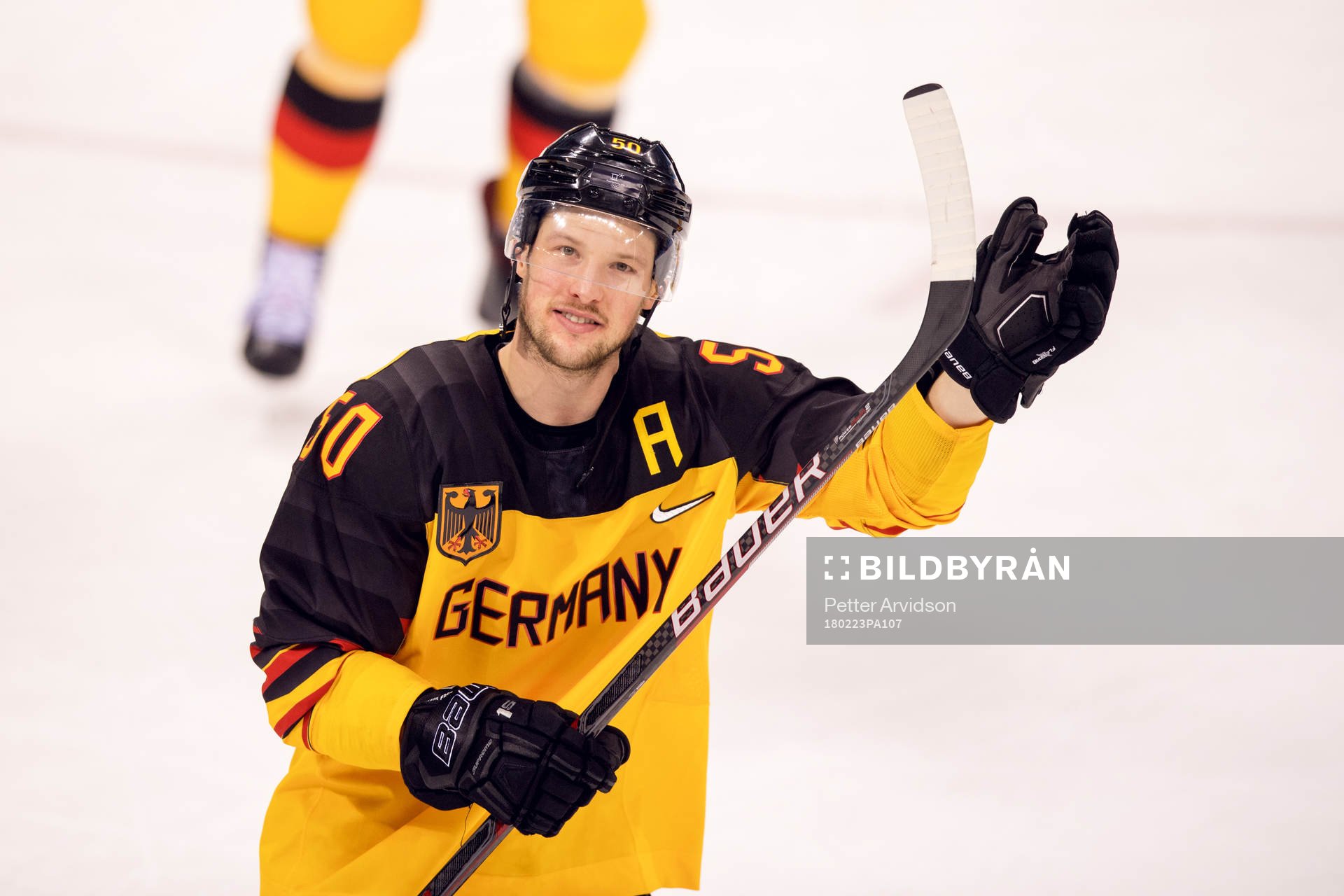 Patrick Hager of Germany celebrates in the Men's ice hockey