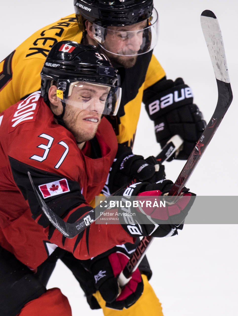 Brooks Macek of Germany and Mat Robinson of Canada in the