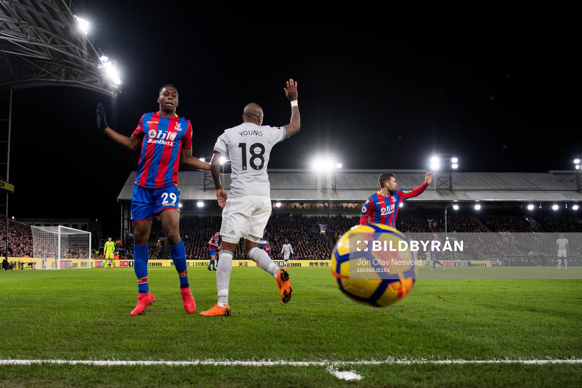 Aaron Wan-Bissaka of Crystal Palace and Ashley Young of